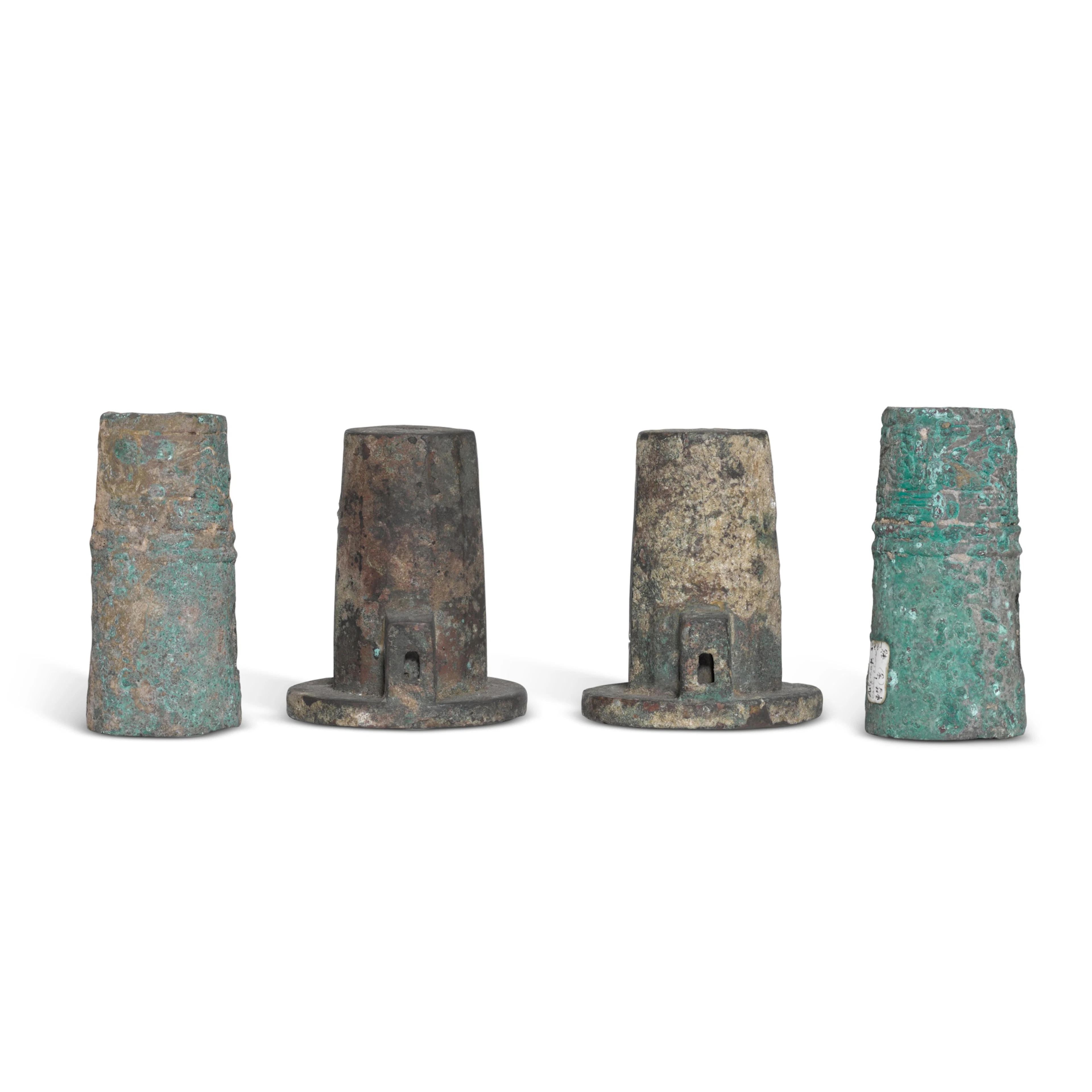 A group of archaic bronze chariot fittings, Zhou dynasty | 周 青銅車馬飾 一組四件