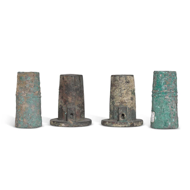 A group of archaic bronze chariot fittings, Zhou dynasty | 周 青銅車馬飾 一組四件