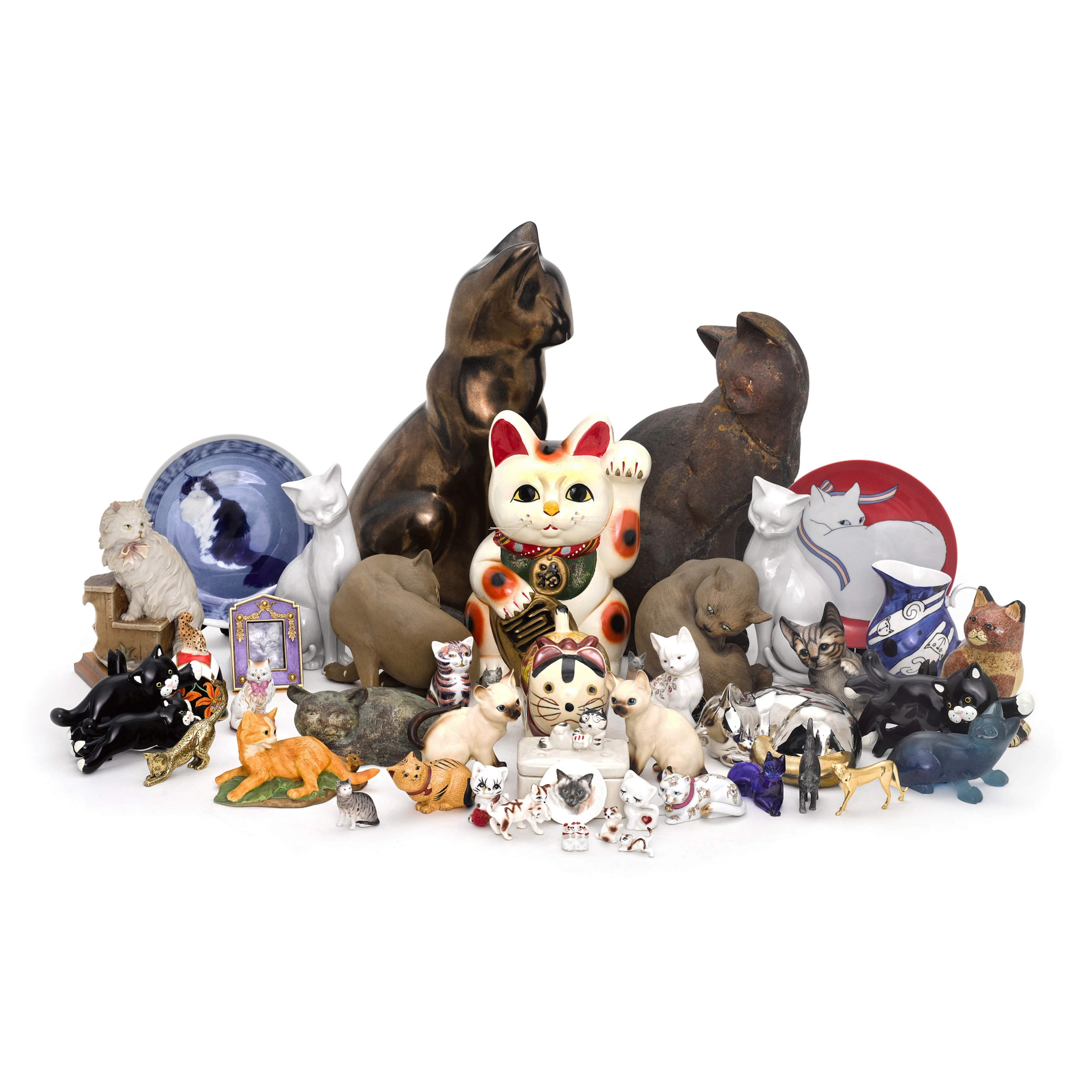 A motley group of feline ornaments, 20th century