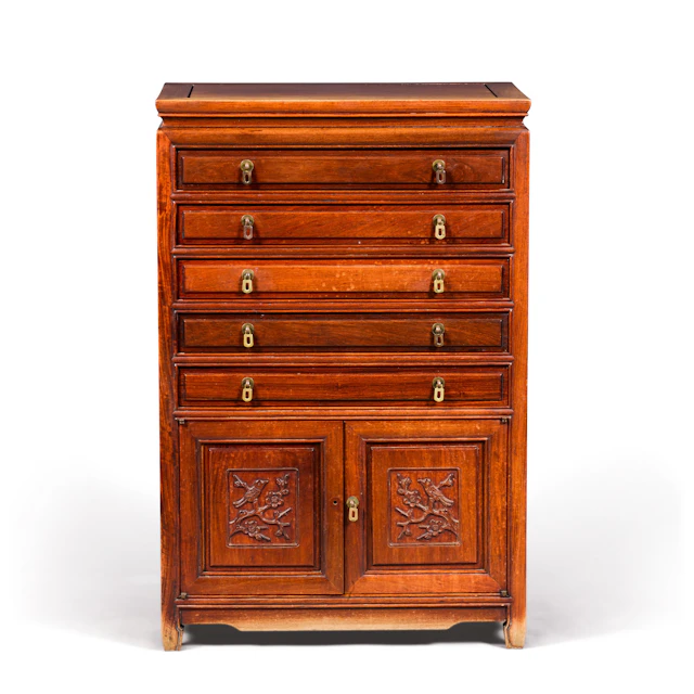 A Chinese hardwood cutlery chest containing a...
