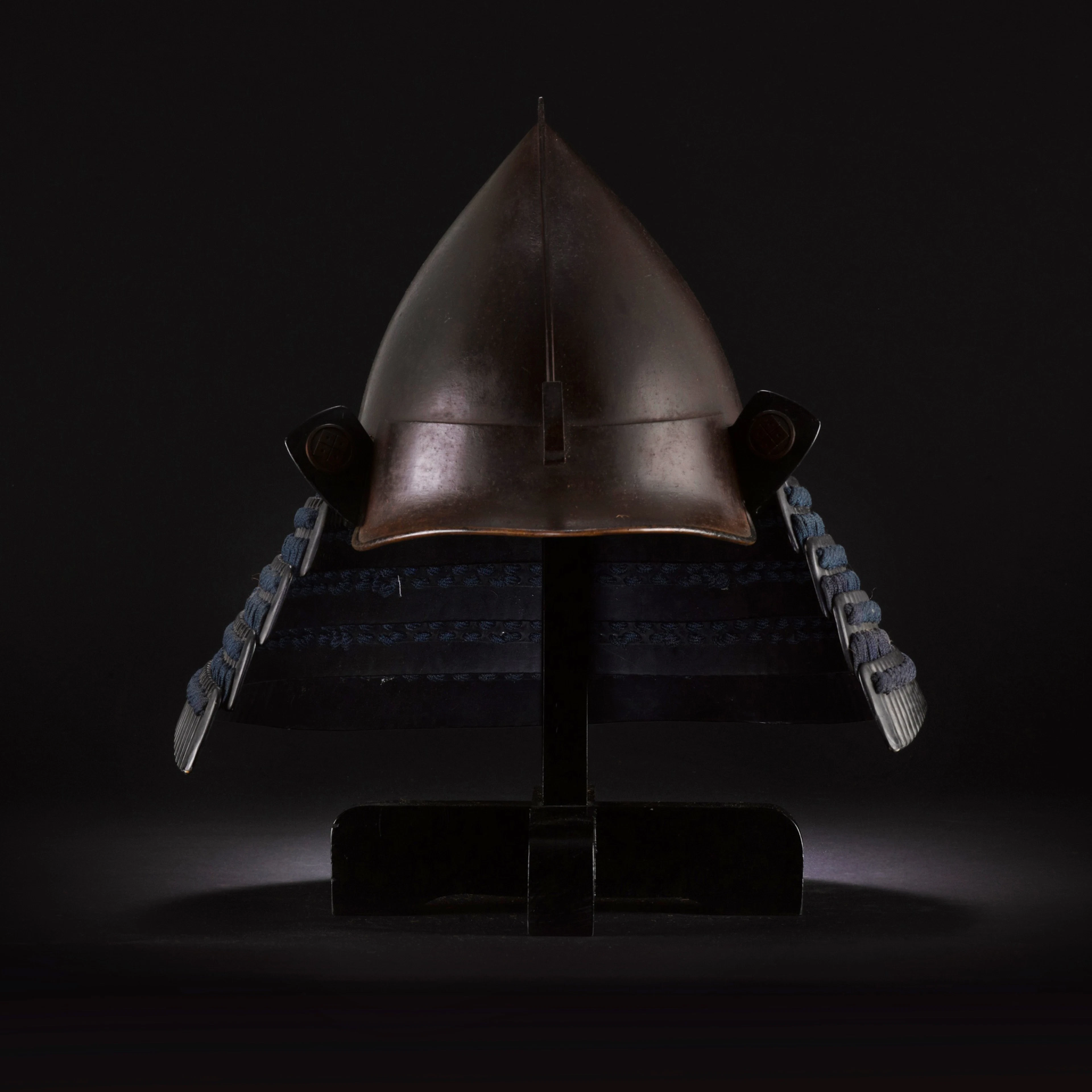 A momonari kabuto [peach-shaped helmet] and an associated...