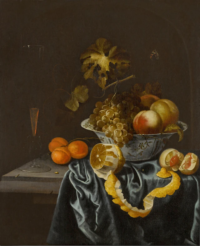 Still life of a porcelain bowl with peaches and grapes