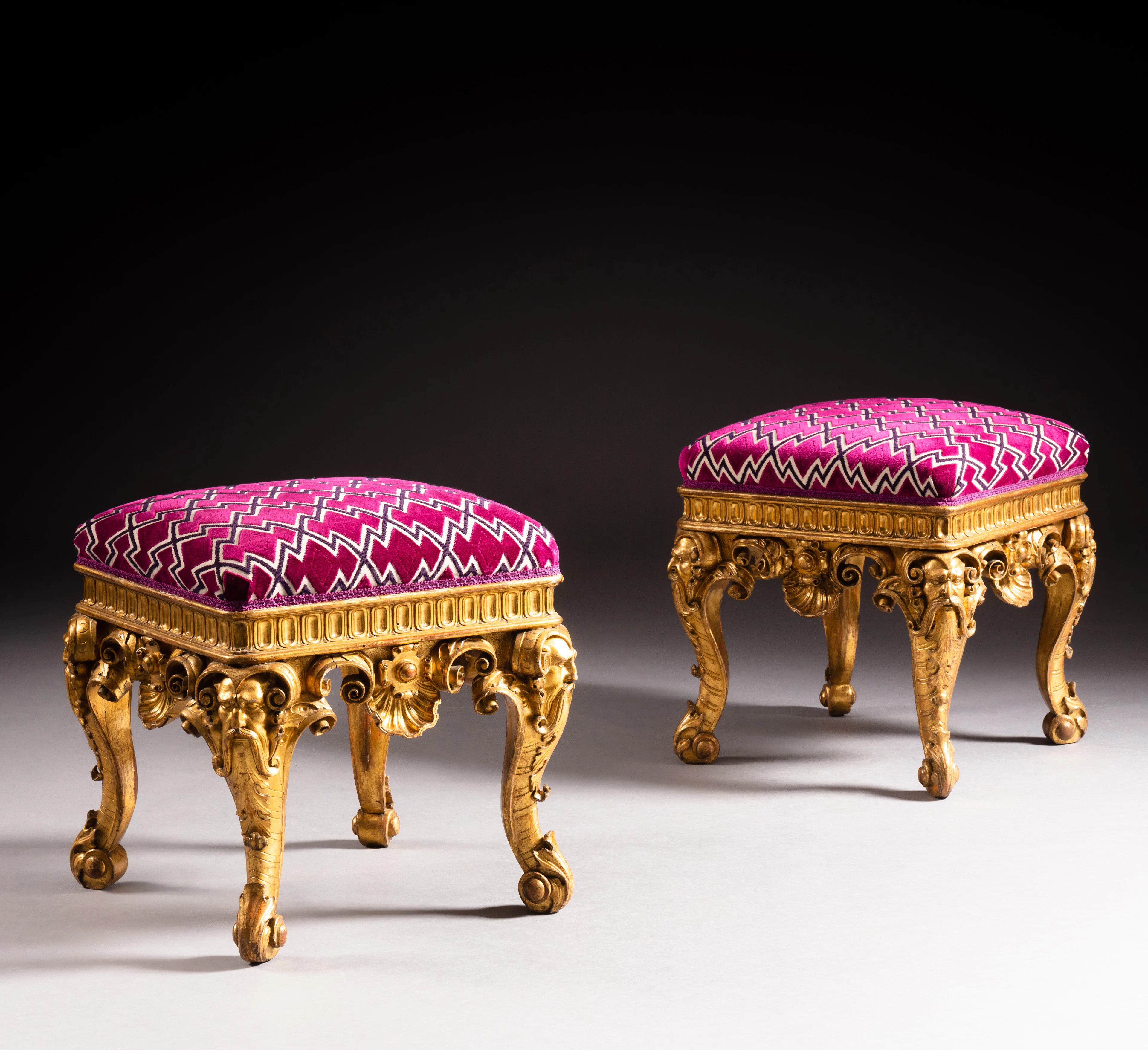 A pair of giltwood stools
