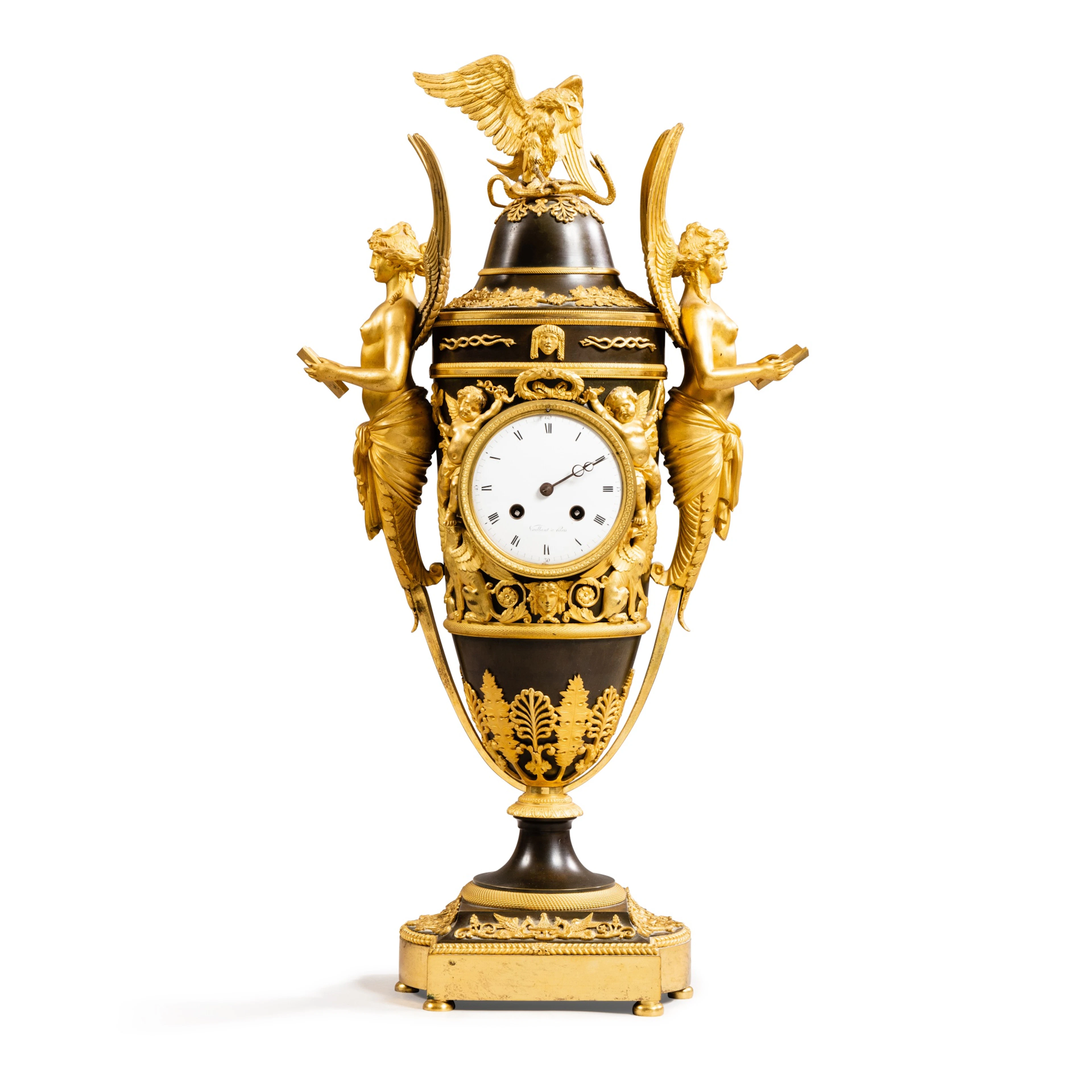 An Empire patined and gilt-bronze mantel clock