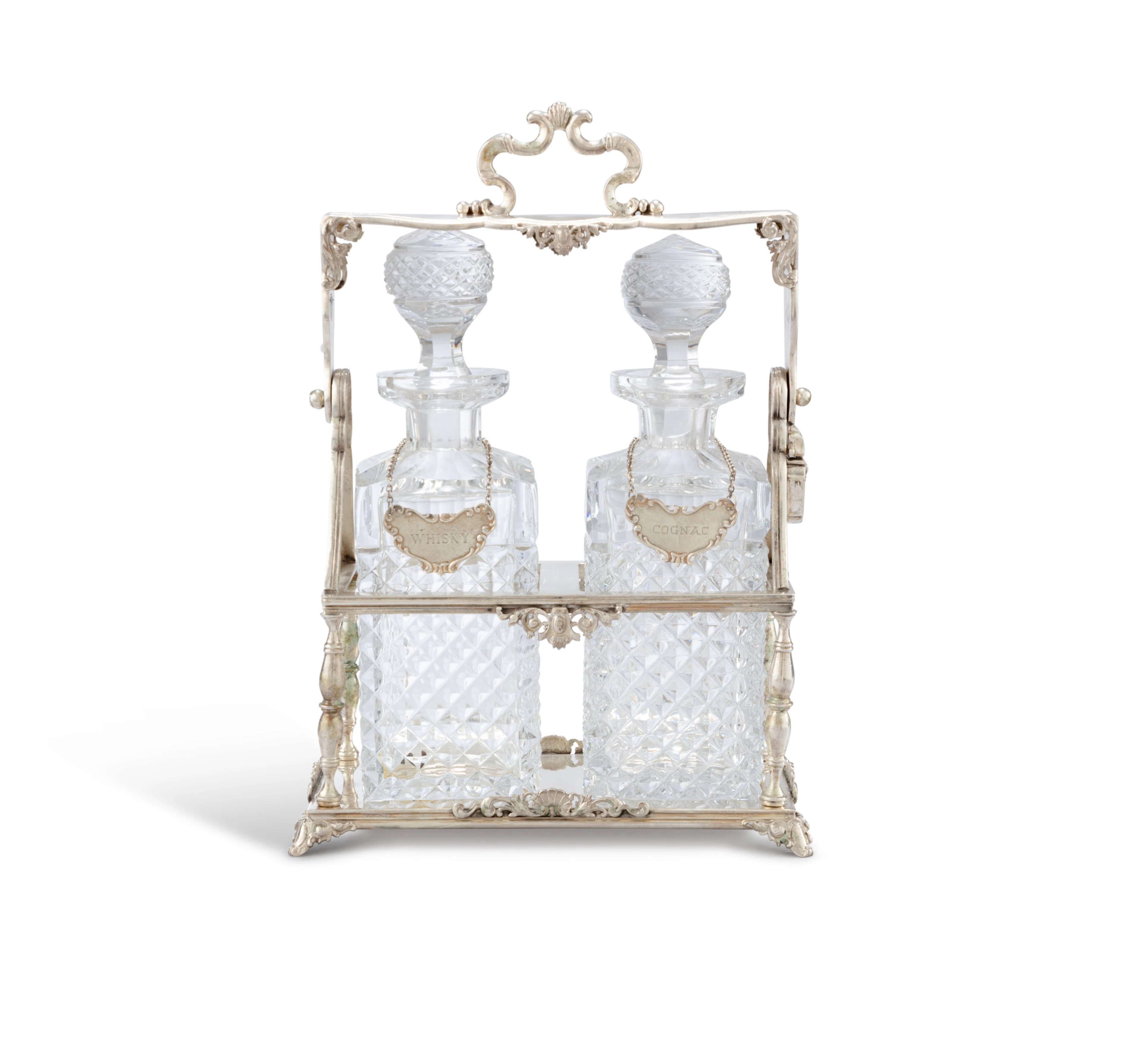 A silver Tantalus (Bottle Holder)