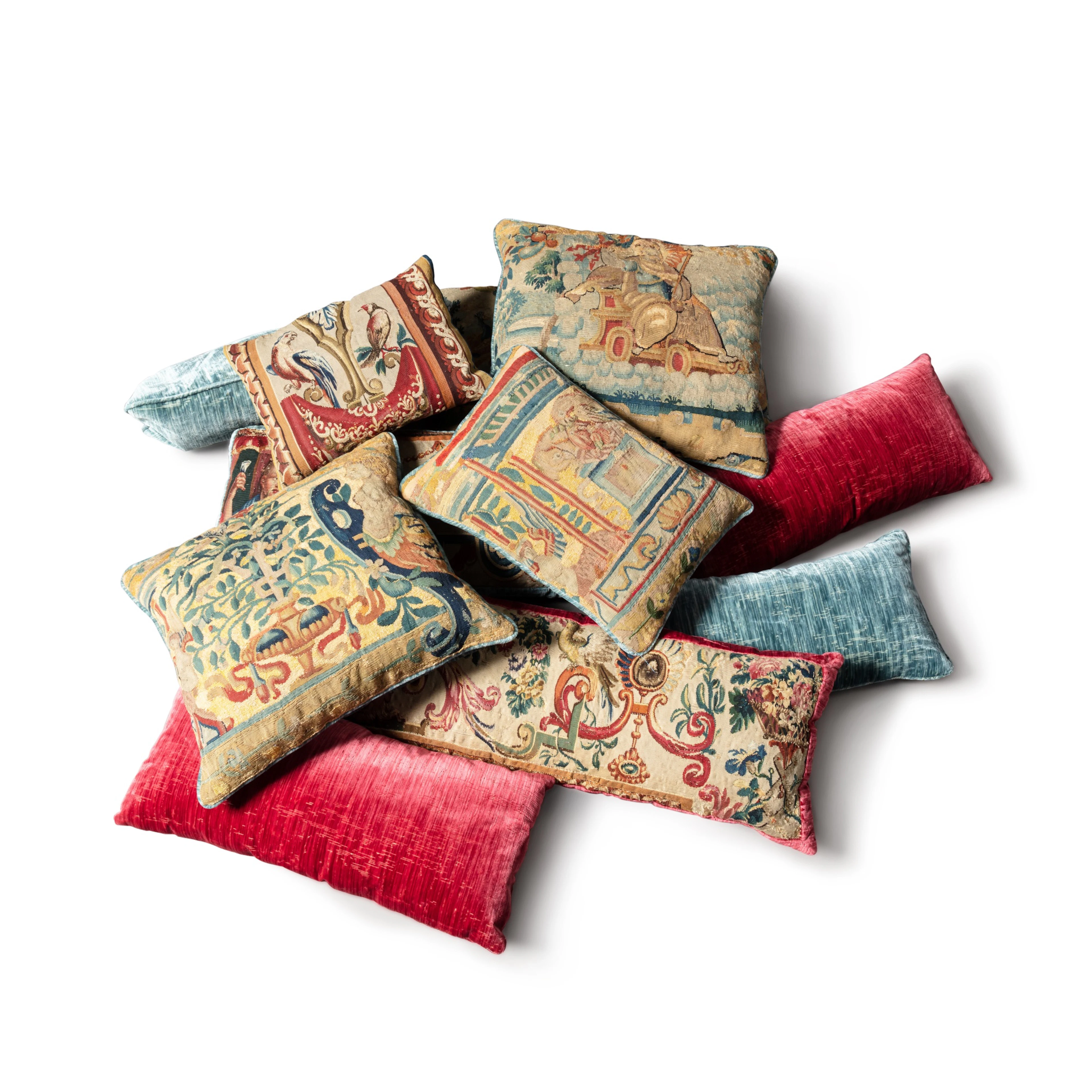 A set of eleven tapestry and velvet cushions