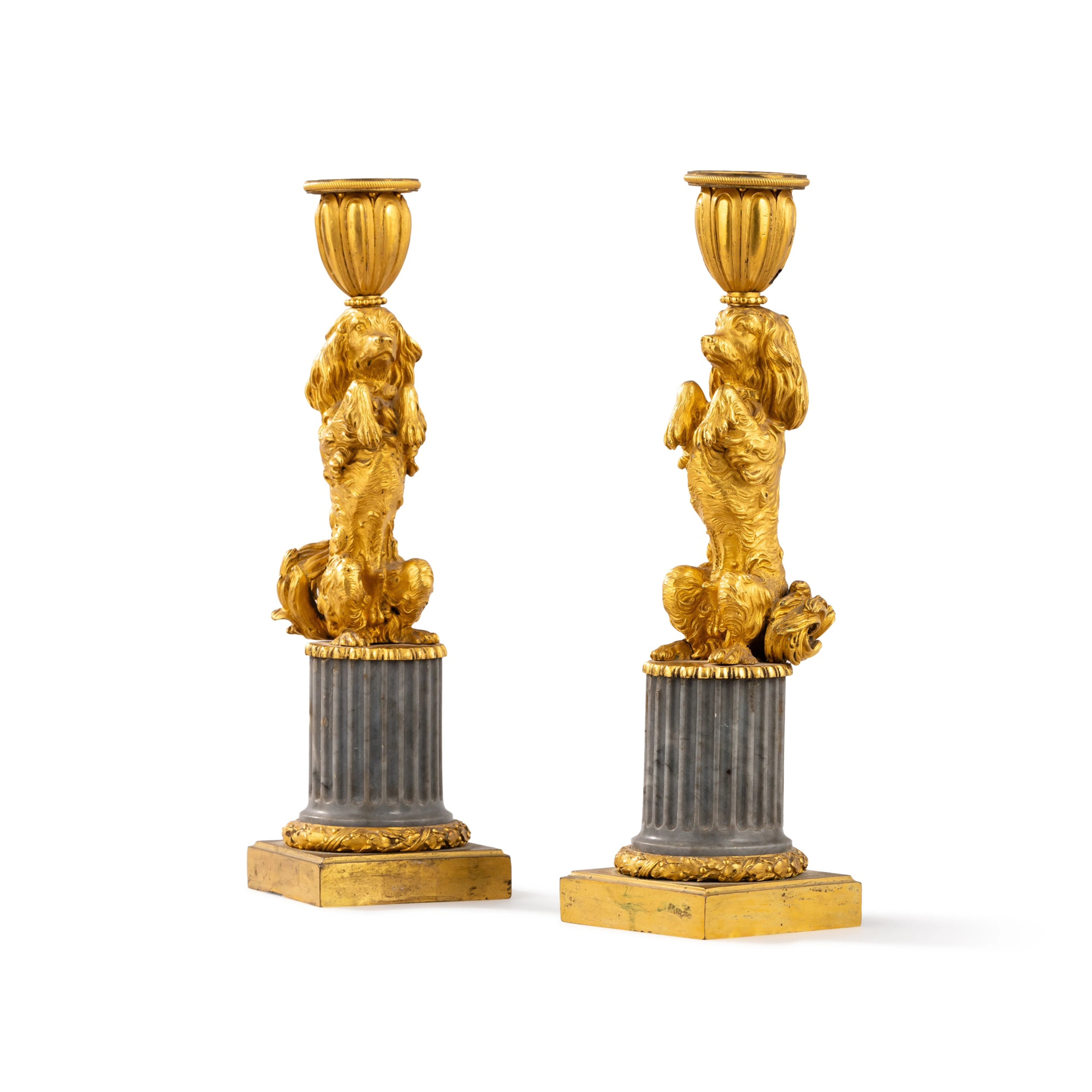 A pair of Louis XVI gilt-bronze and marble "aux chiens savants" candlesticks