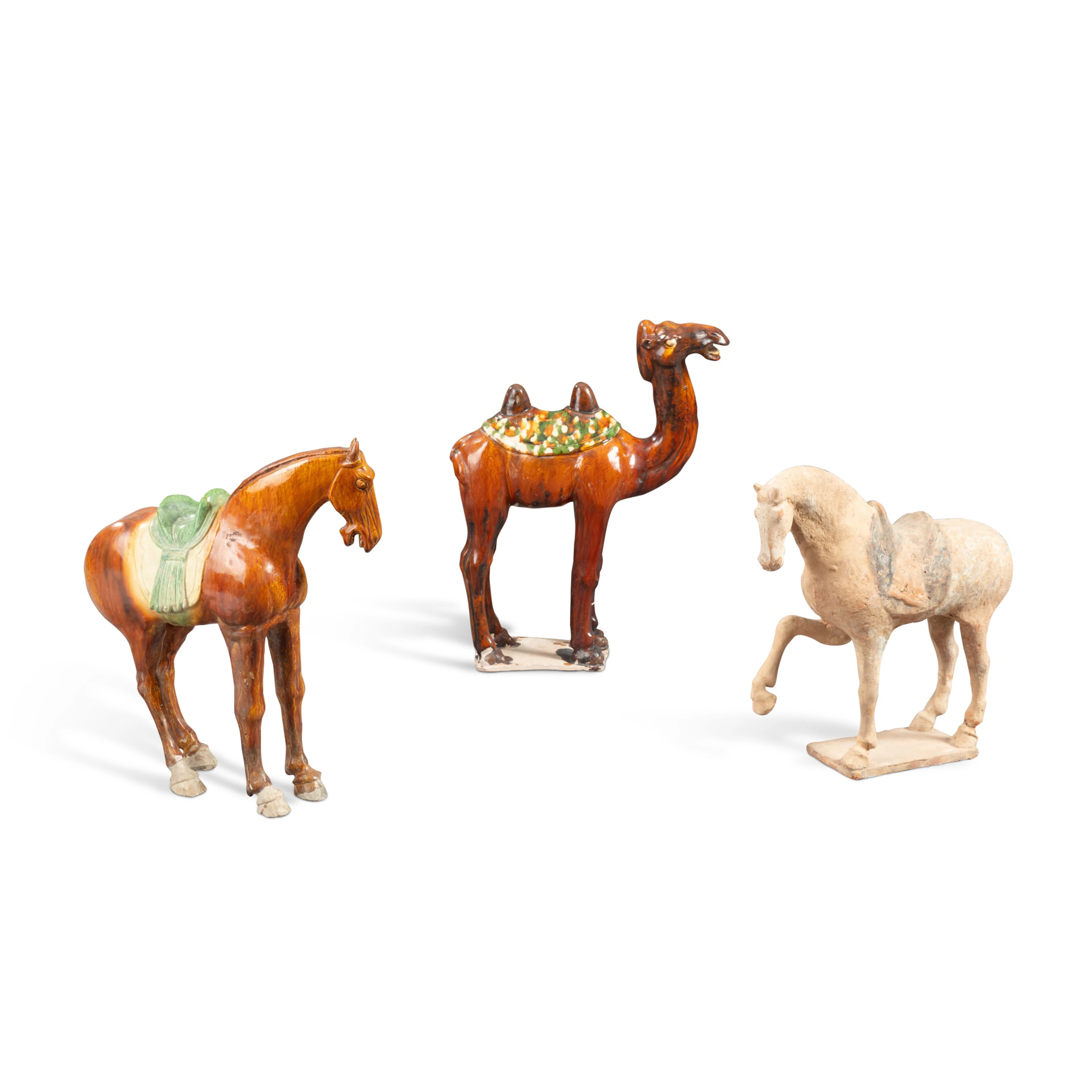 A group of three pottery figures of animals