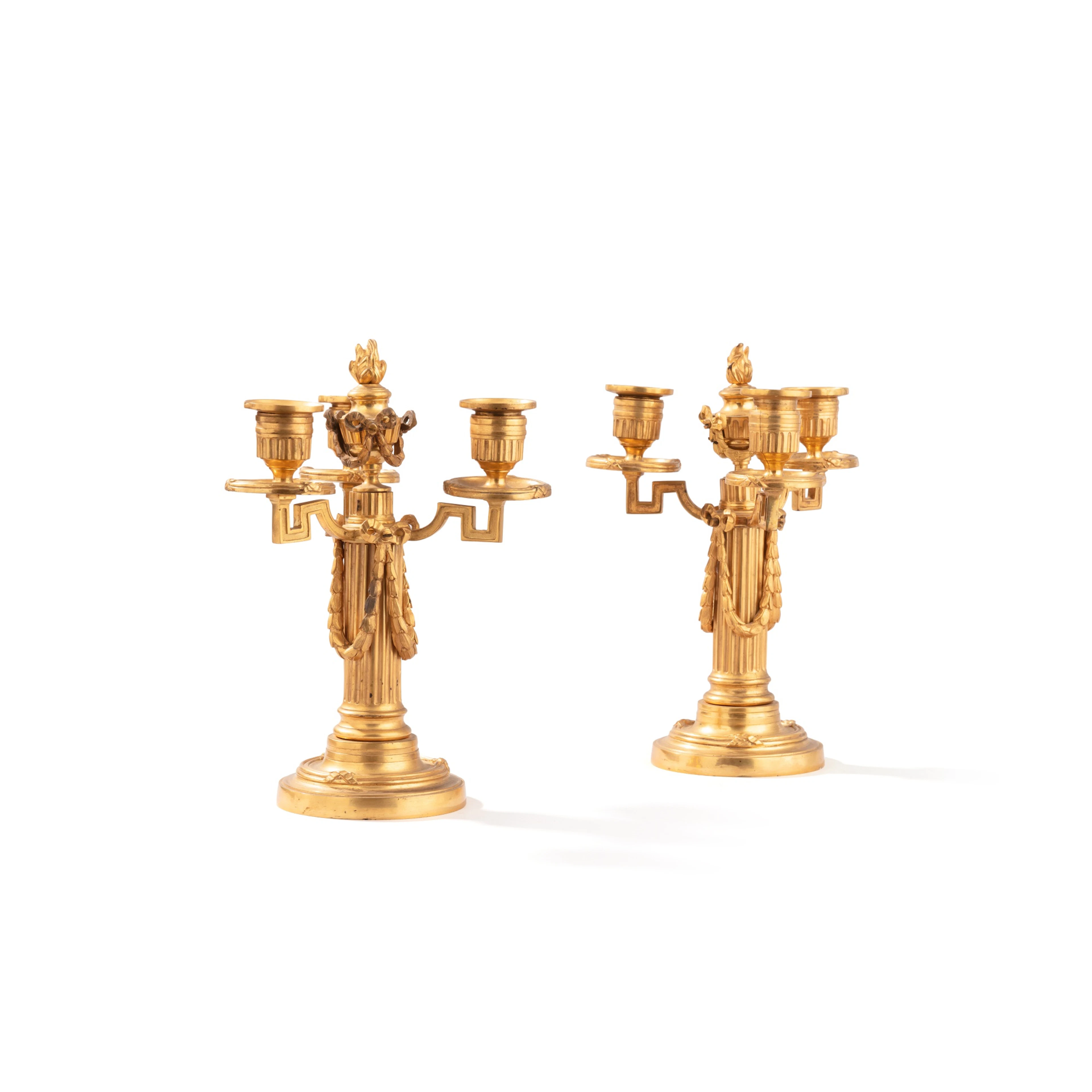 A pair of Louis XVI style gilt-bronze candelabras