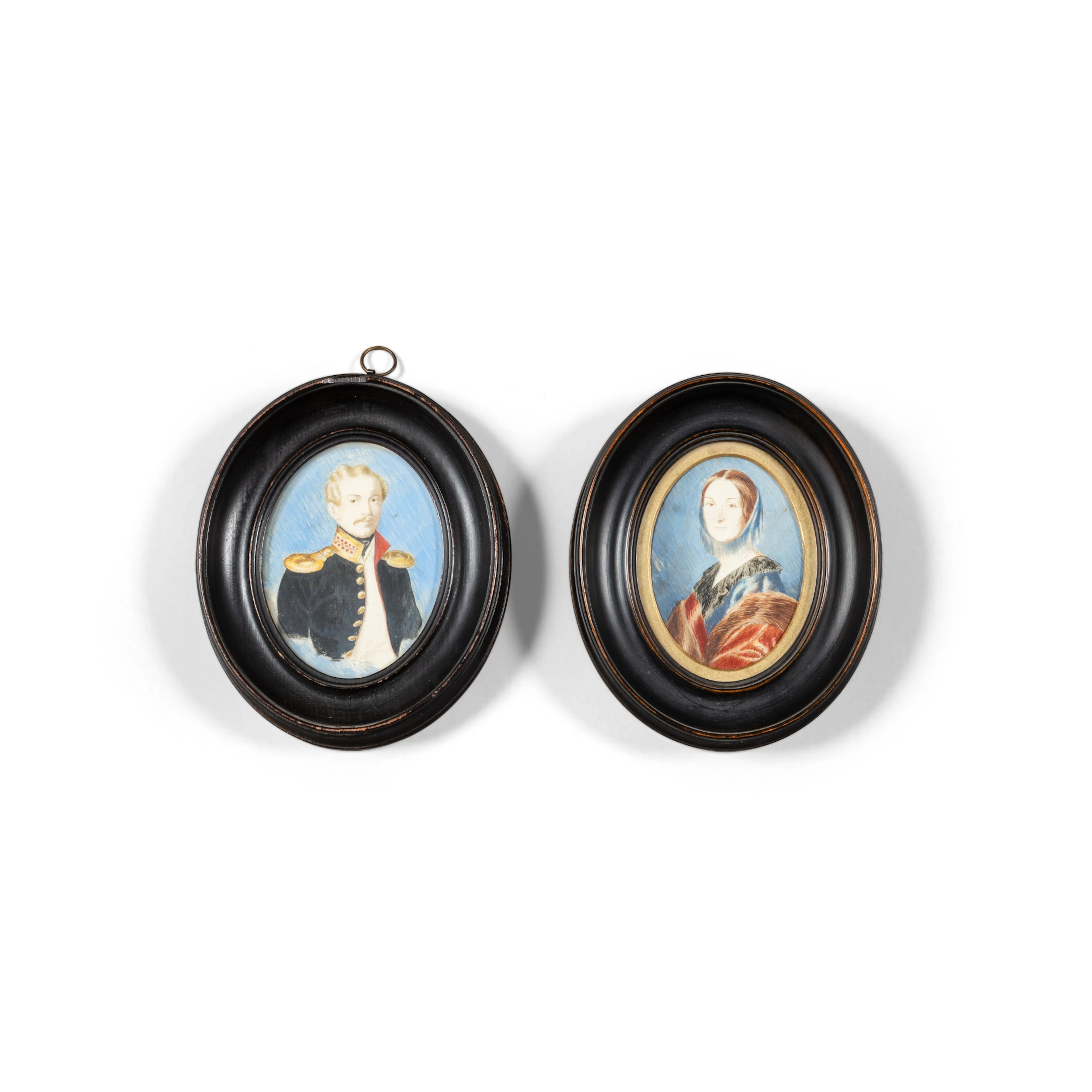 Two oval miniatures on paper representing a young officer and a lady