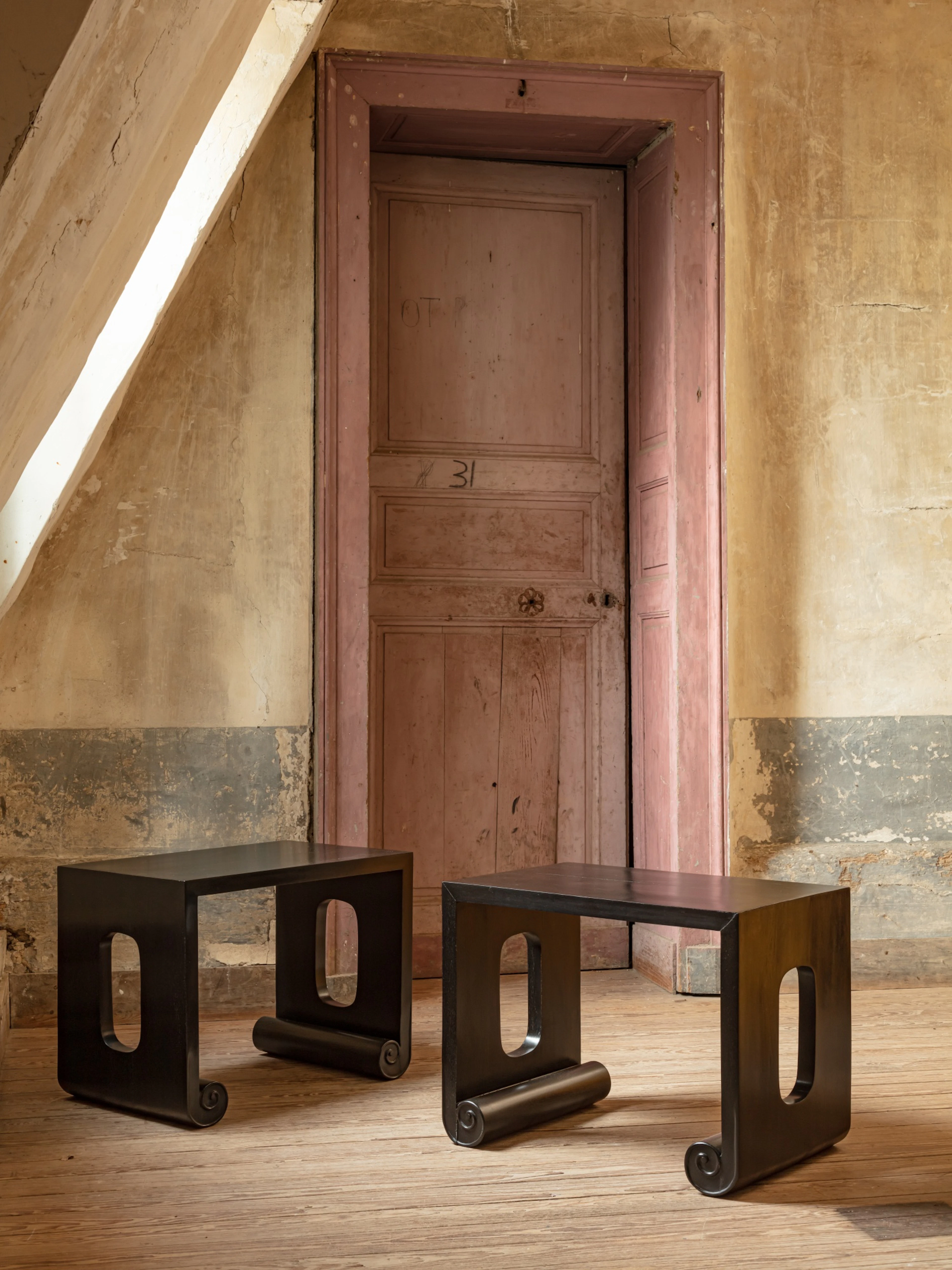 A pair of ebony side tables