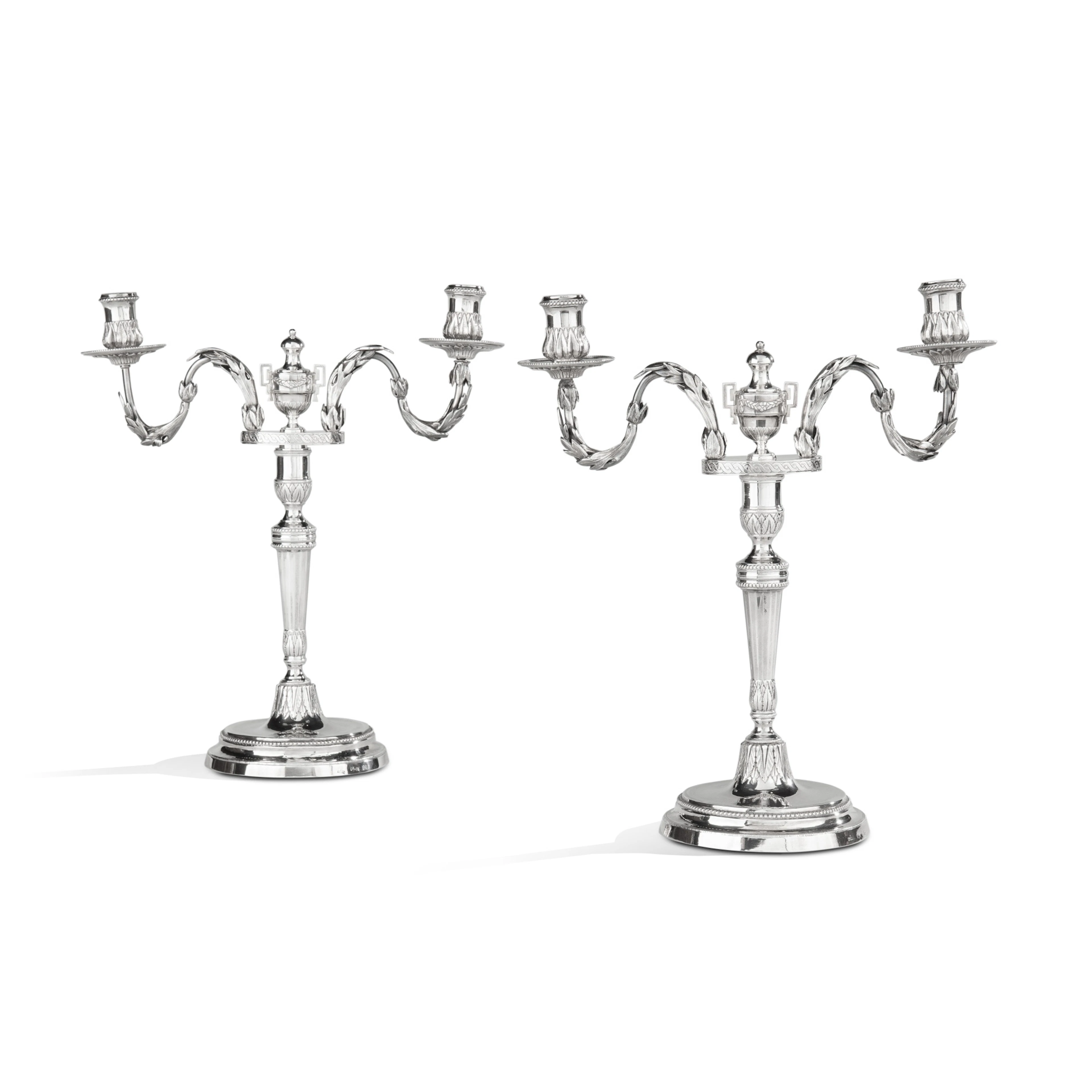 A pair of silver Spanish two-branch candelabra