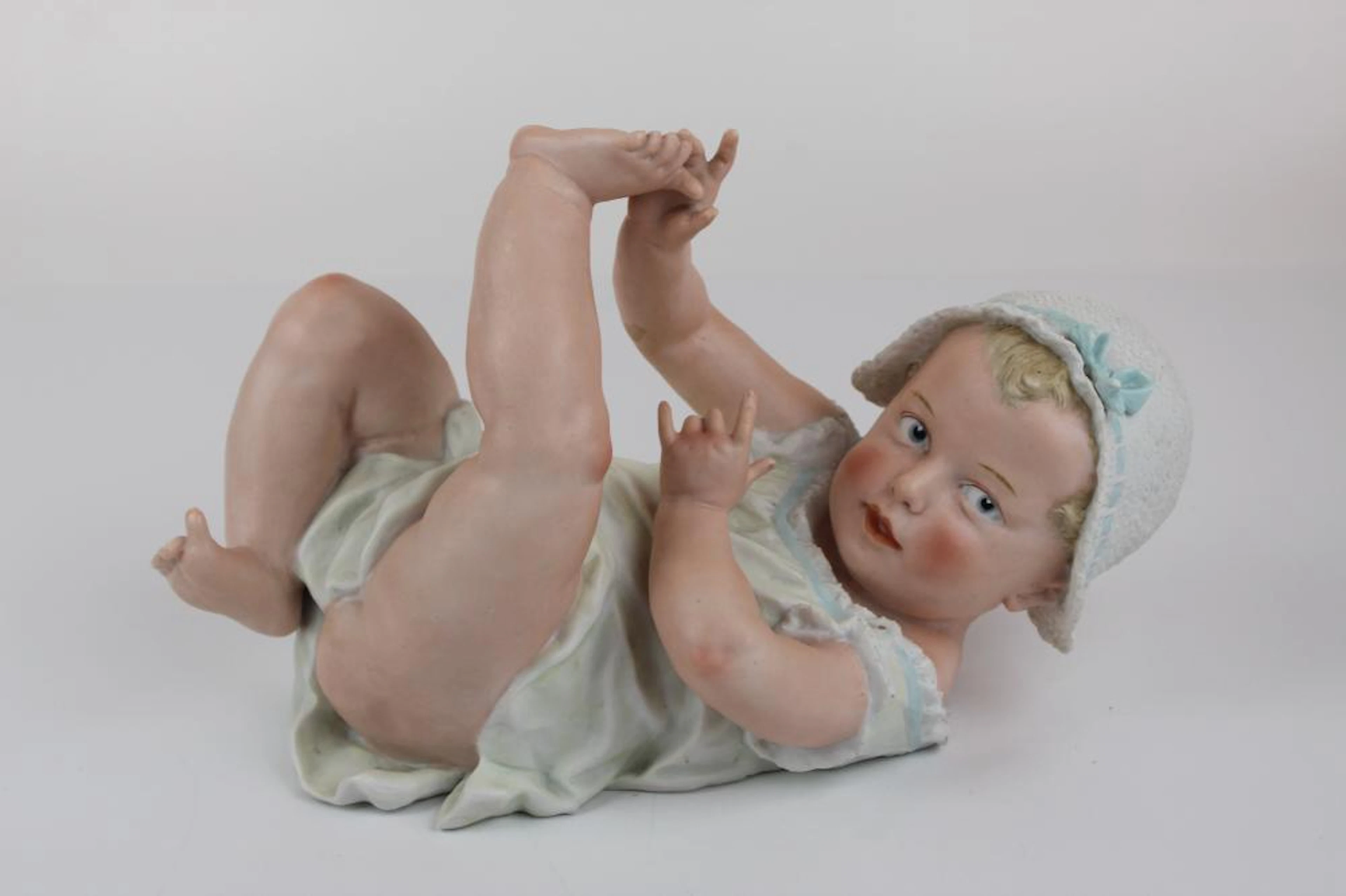 Bisque Piano Baby with Bow (laying on back)