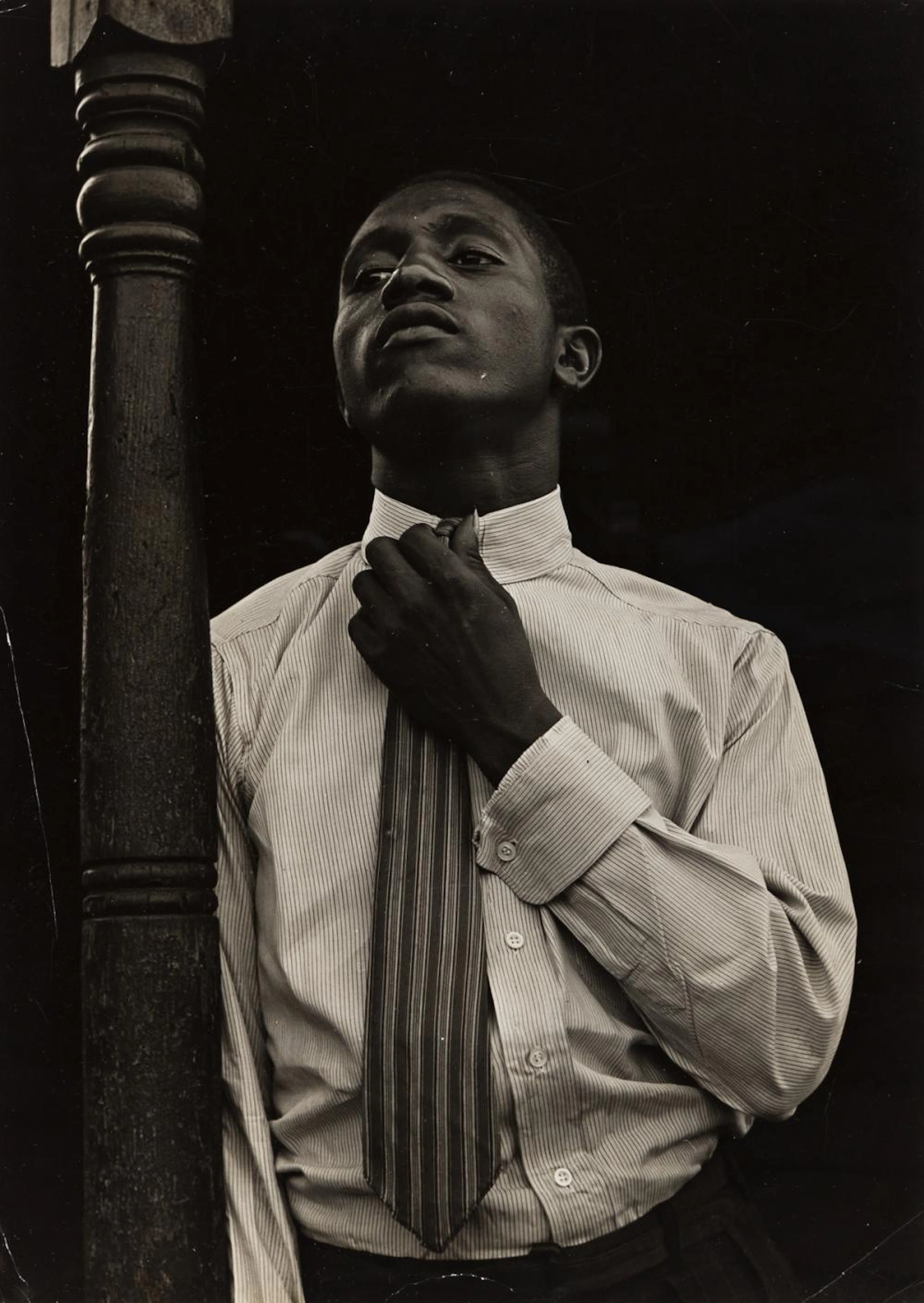 ARTHUR ROTHSTEIN (1915-1985) Portrait of a young African American man.