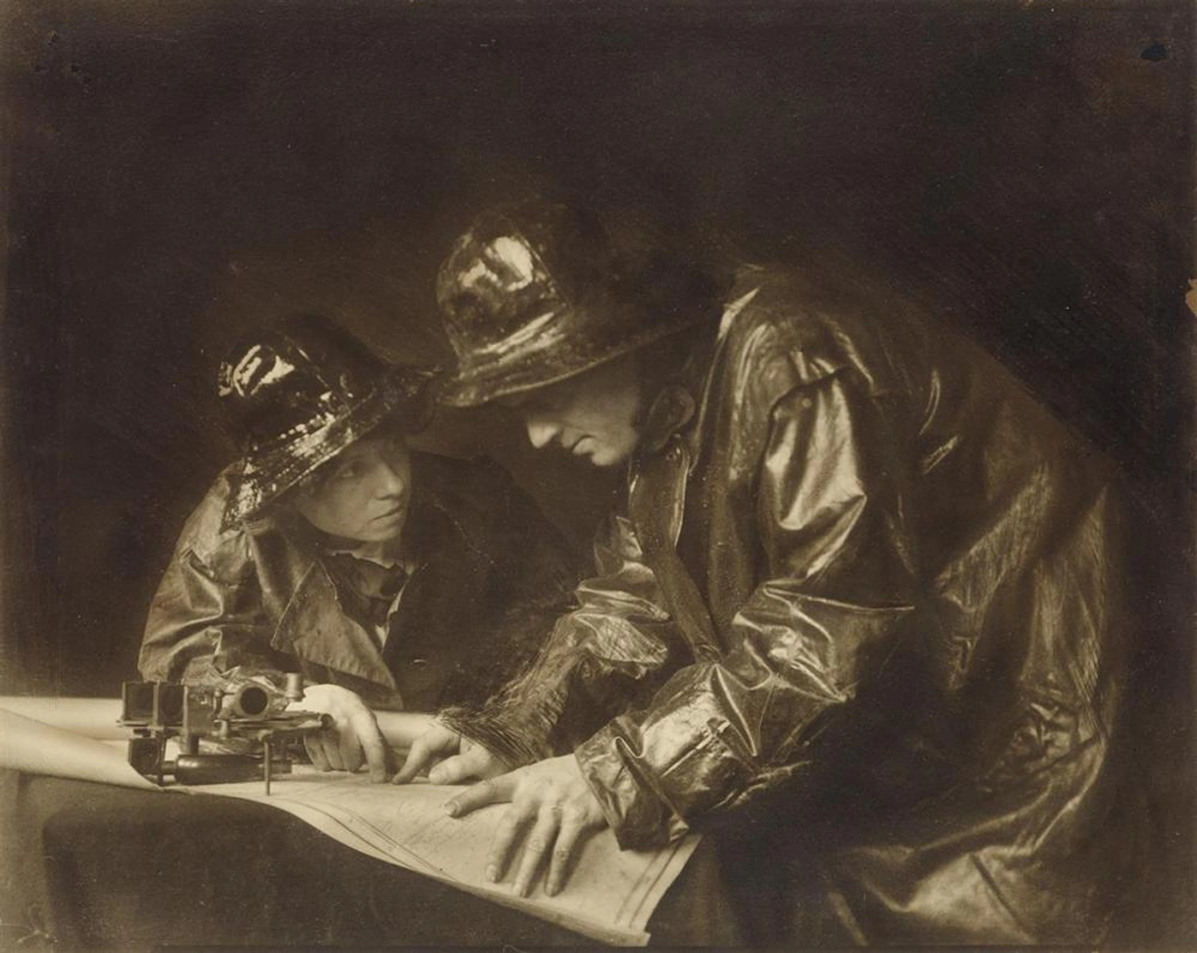 ANNE BRIGMAN (1869-1950) Jack London and his wife, Charmain, examining a map.