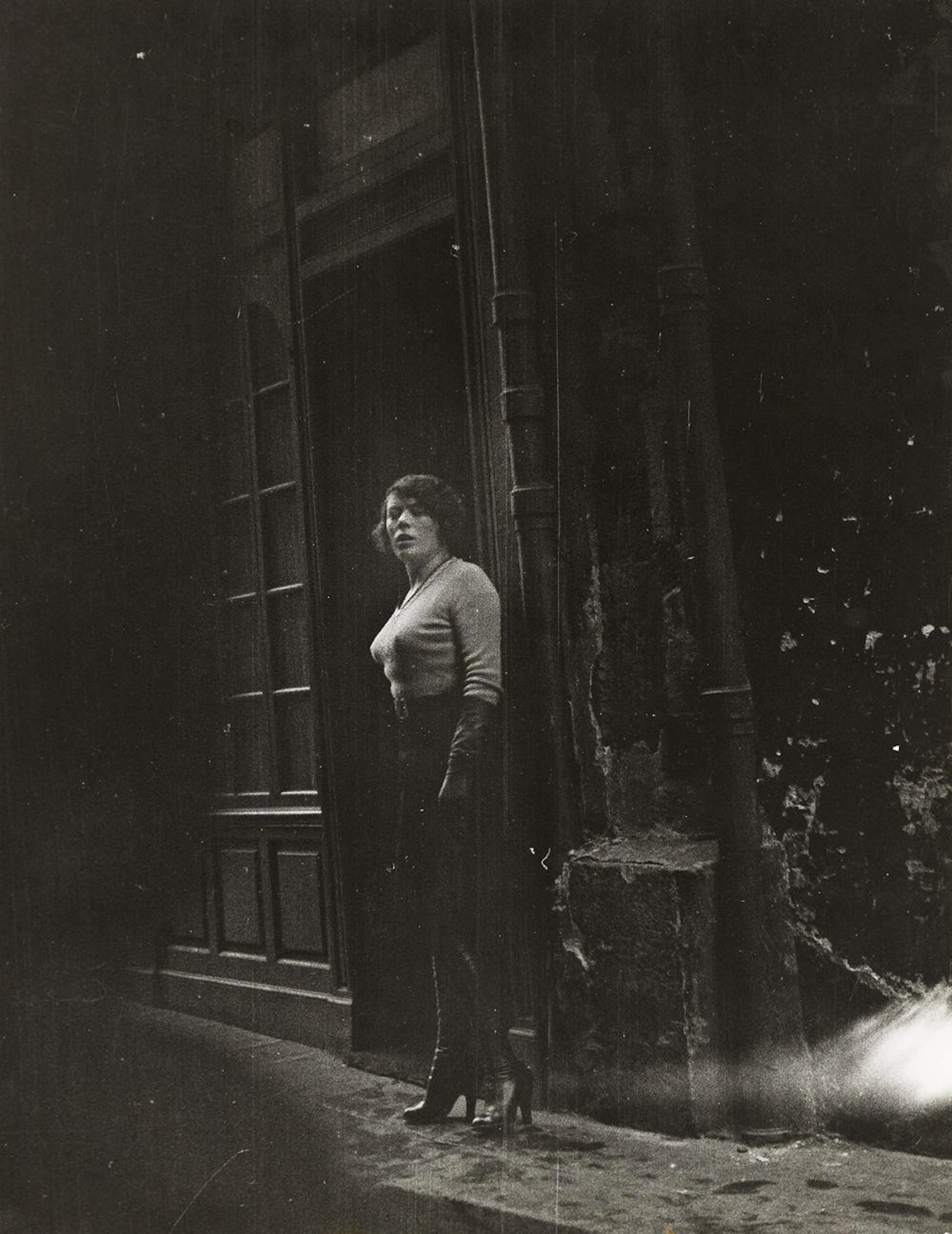 ALFRED EISENSTAEDT (1898-1995) Streetwalker, Rue St. Denis, Paris.