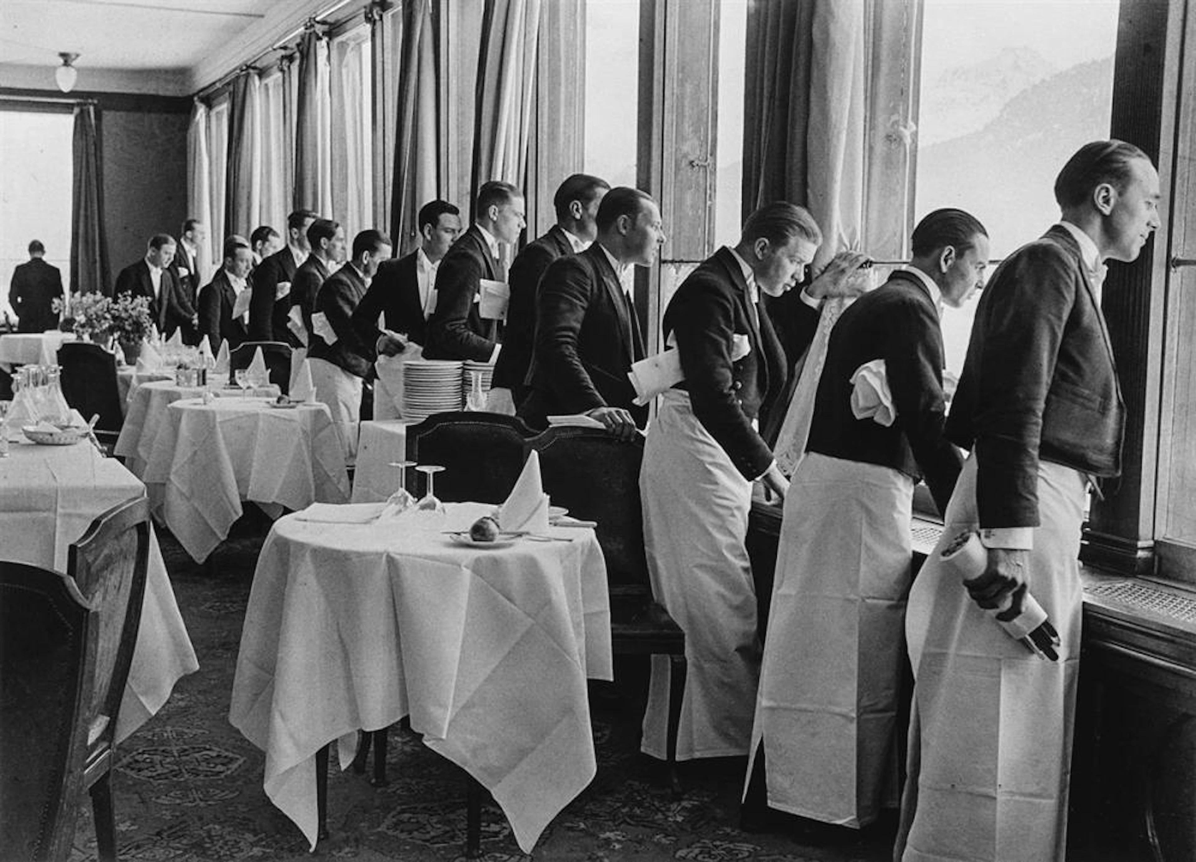 ALFRED EISENSTAEDT (1898-1995) Waiters watching Sonie Heine skate
