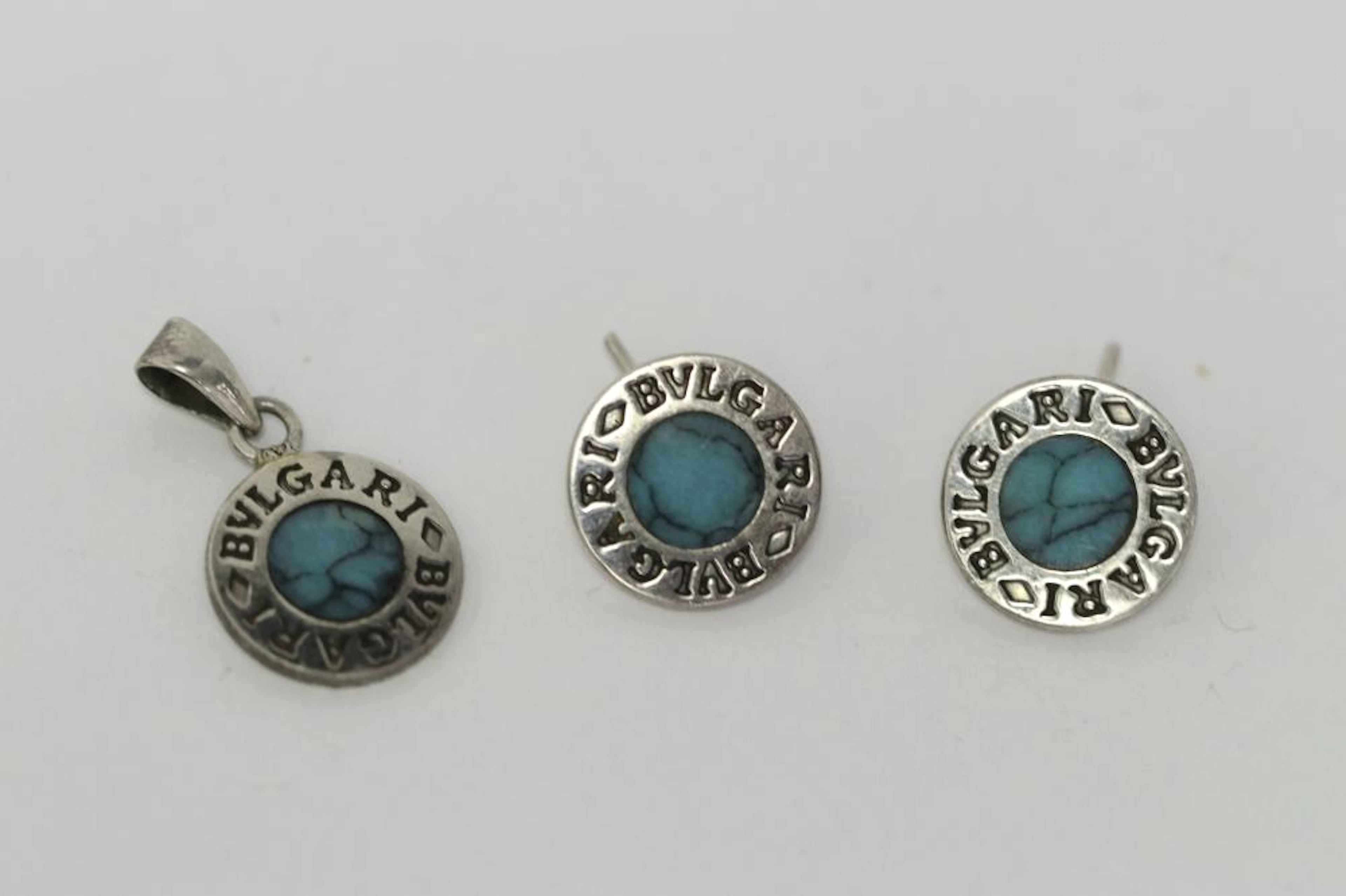 Pair Bvlgari silver earrings, & a silver pendant
