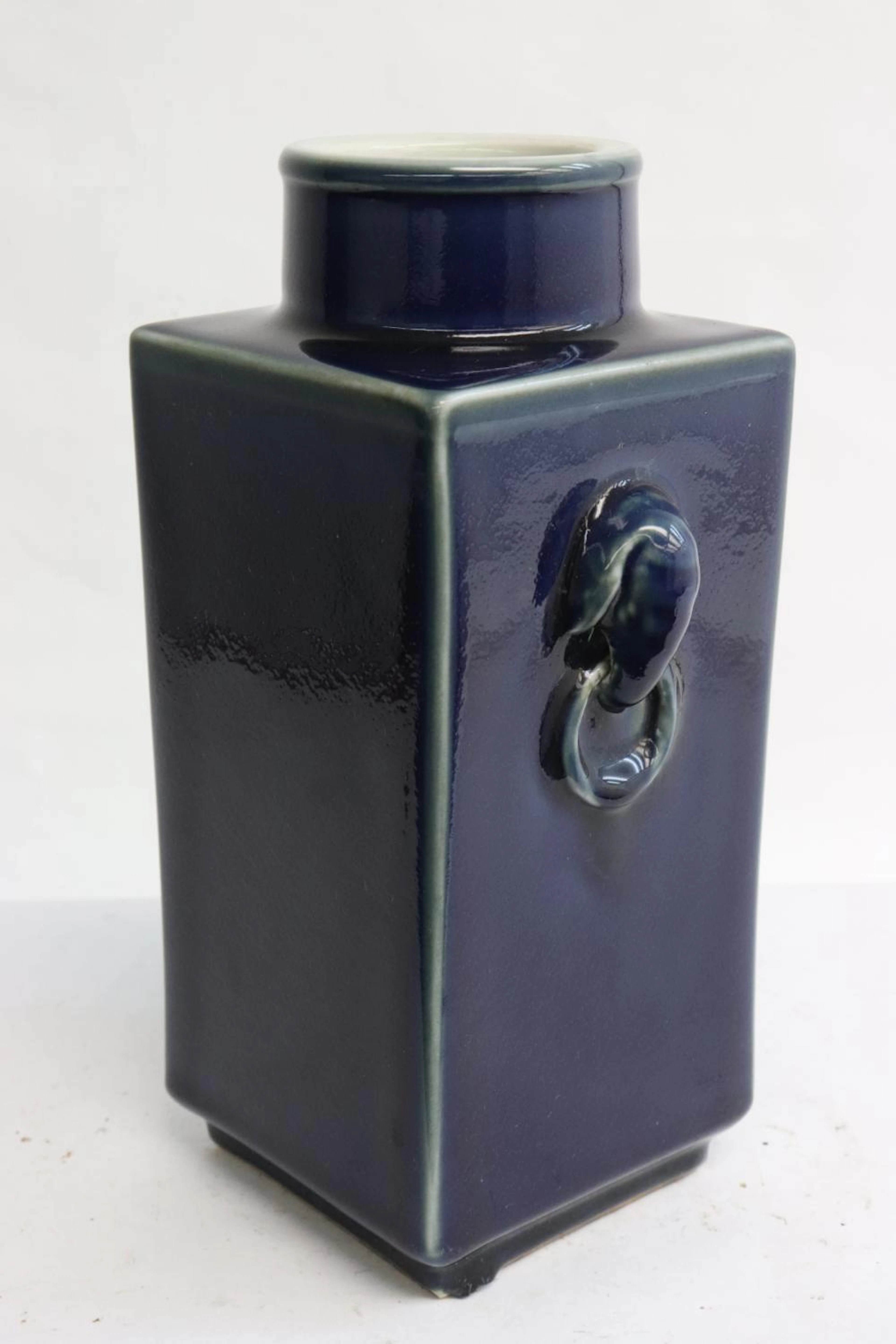 A blue glazed square porcelain vase