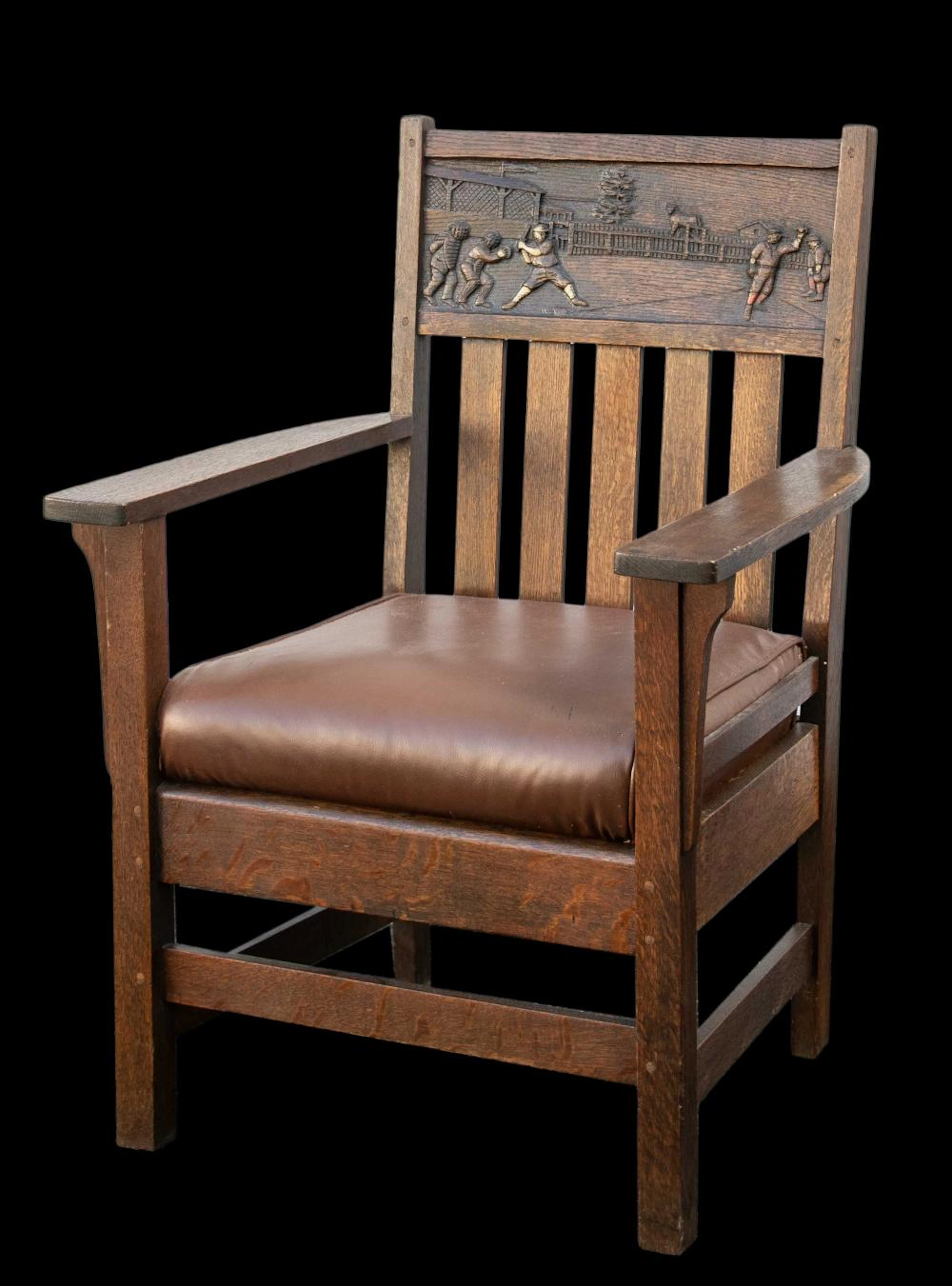 Arts and Crafts armchair with baseball decoration c.1910-1915.