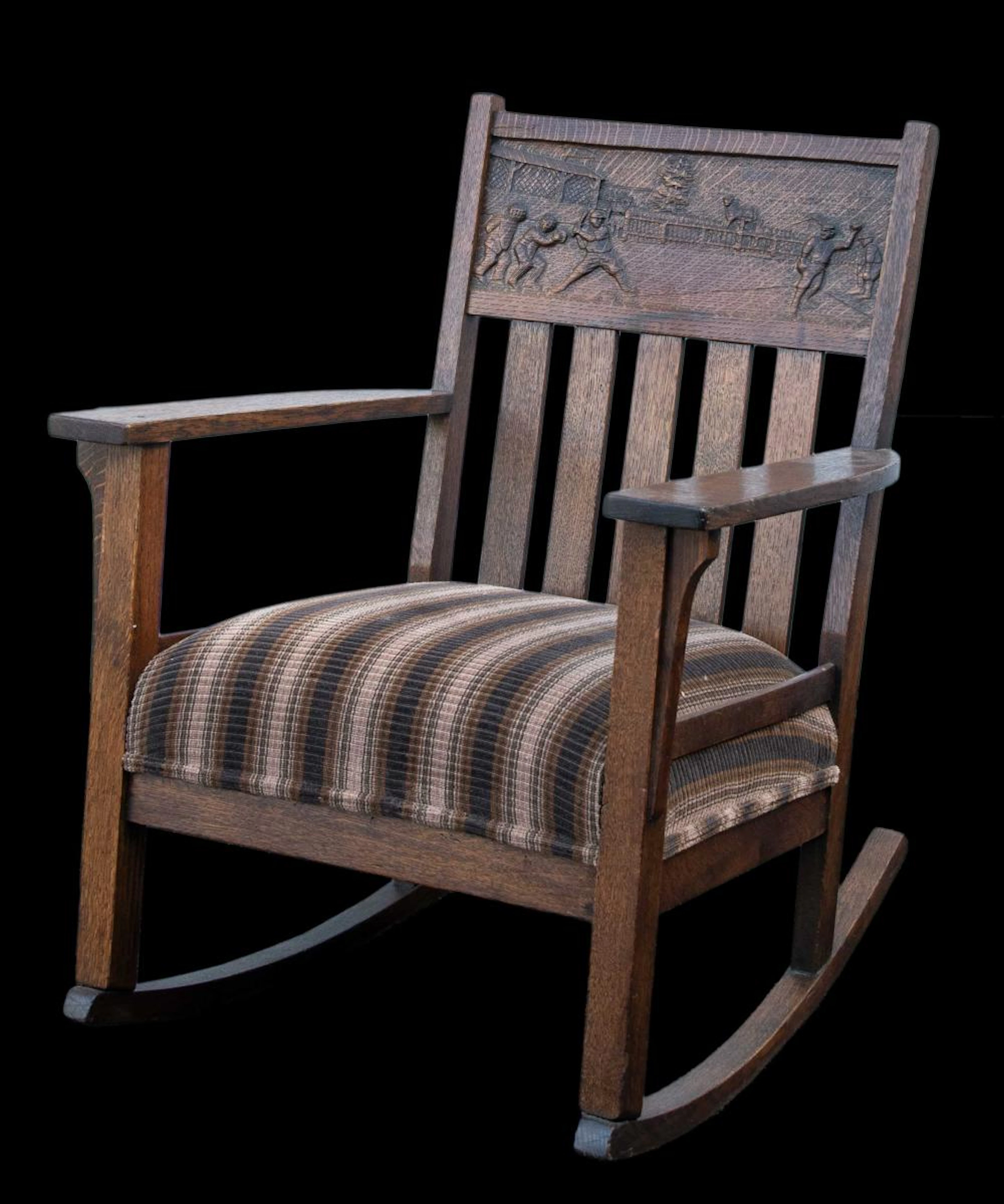 Arts and Crafts rocking armchair with baseball decoration c.1910-1915.