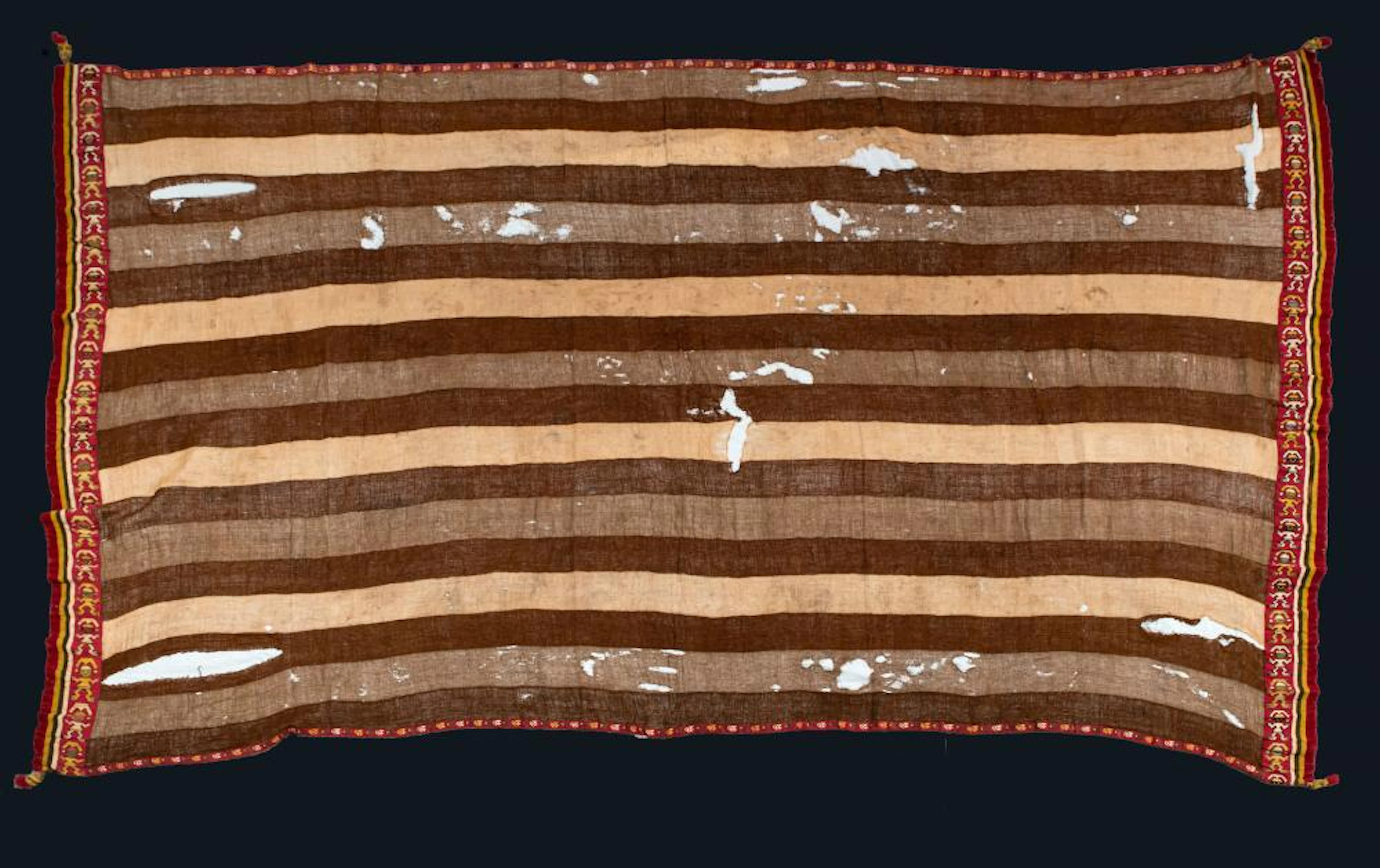 A Stripped Mantle with Decorated Border