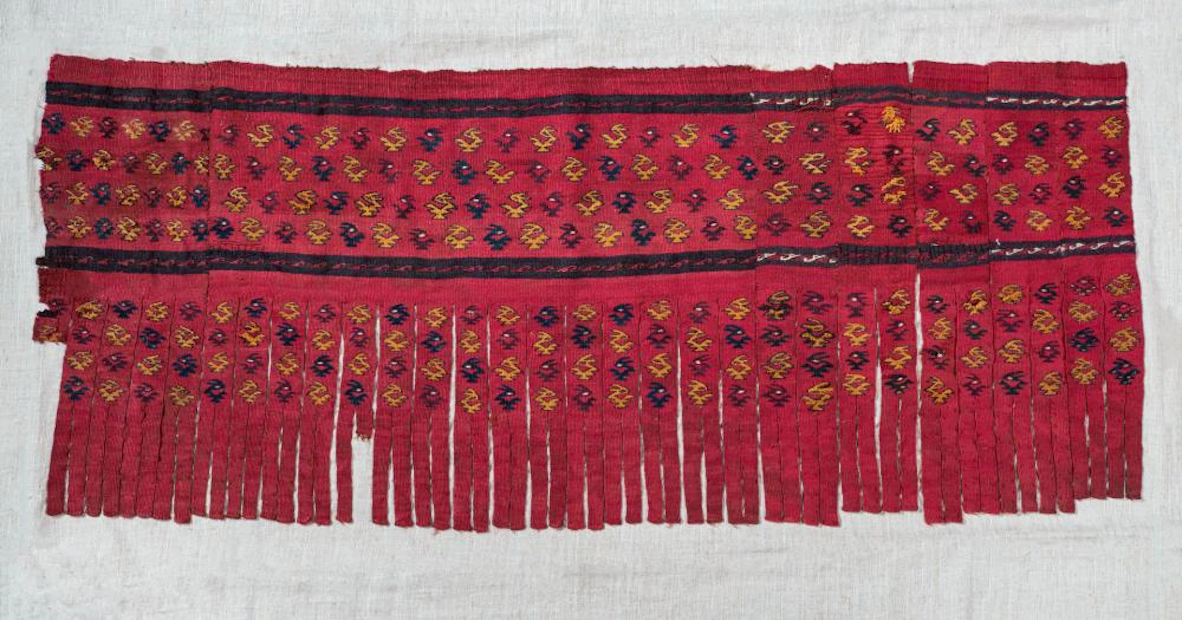 A Deep Red Mantle Border with Stylized Birds