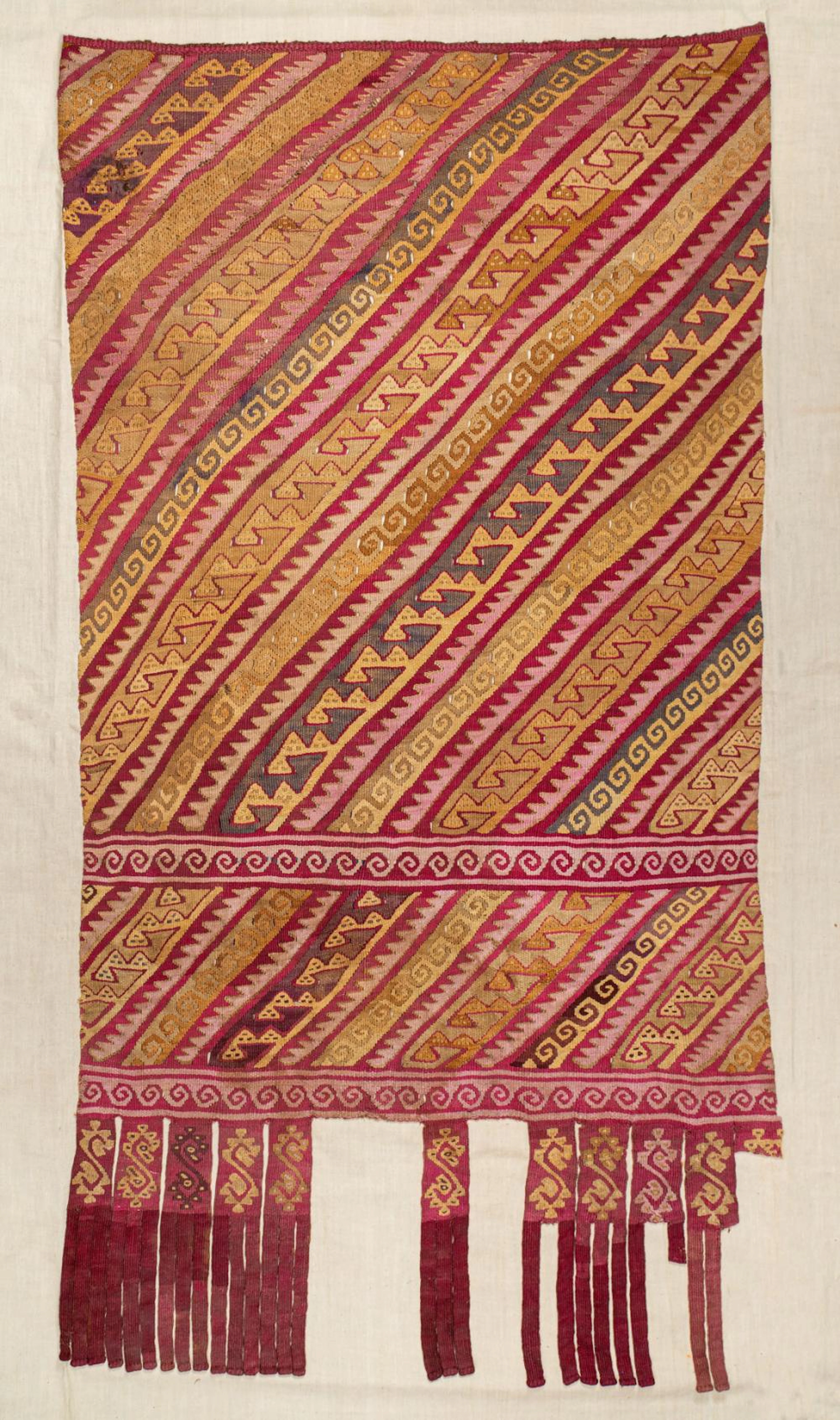 A Mantle with Diagonal Stripes and Geometric Designs