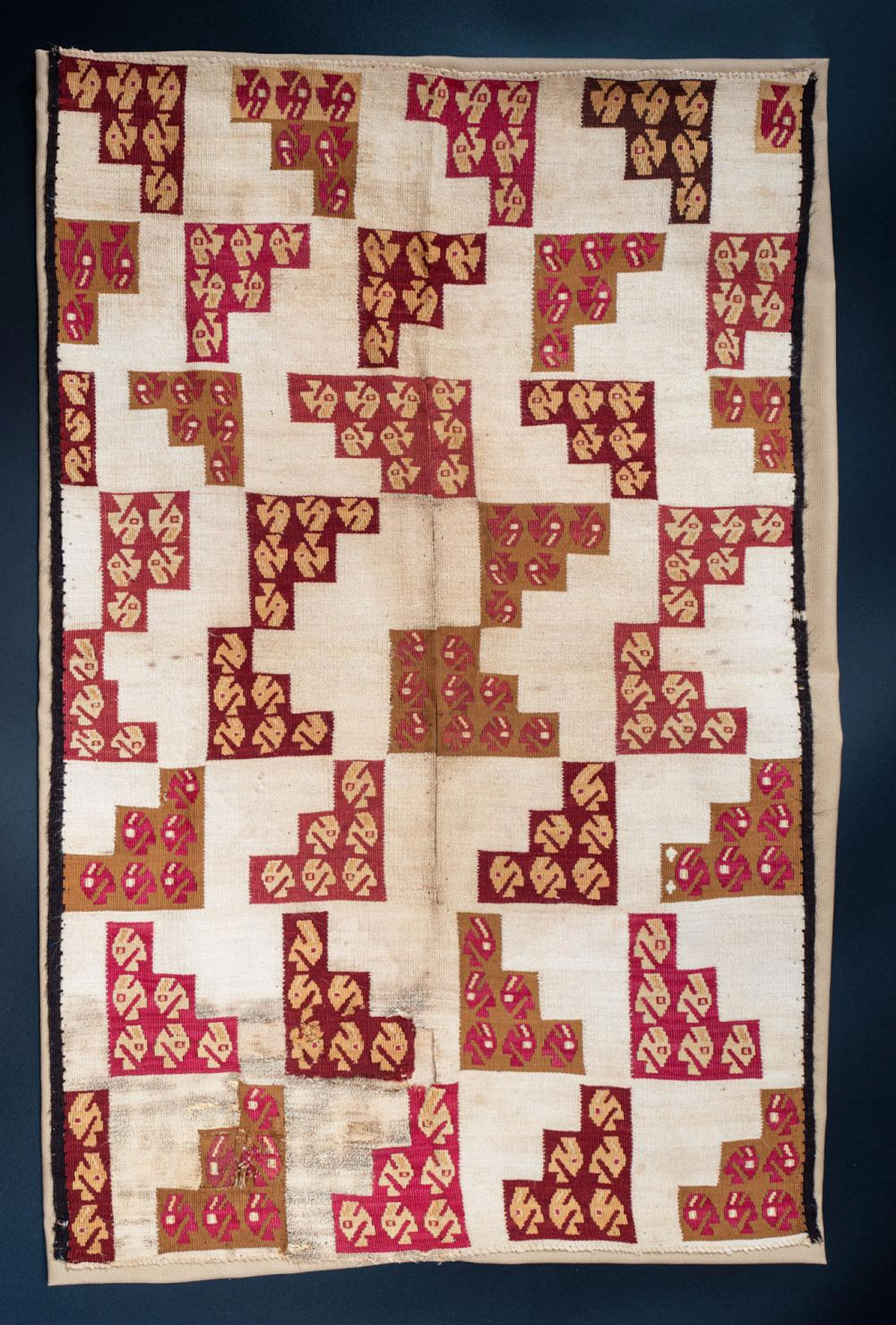 A Panel Fragment or Small Shirt with Step Triangles