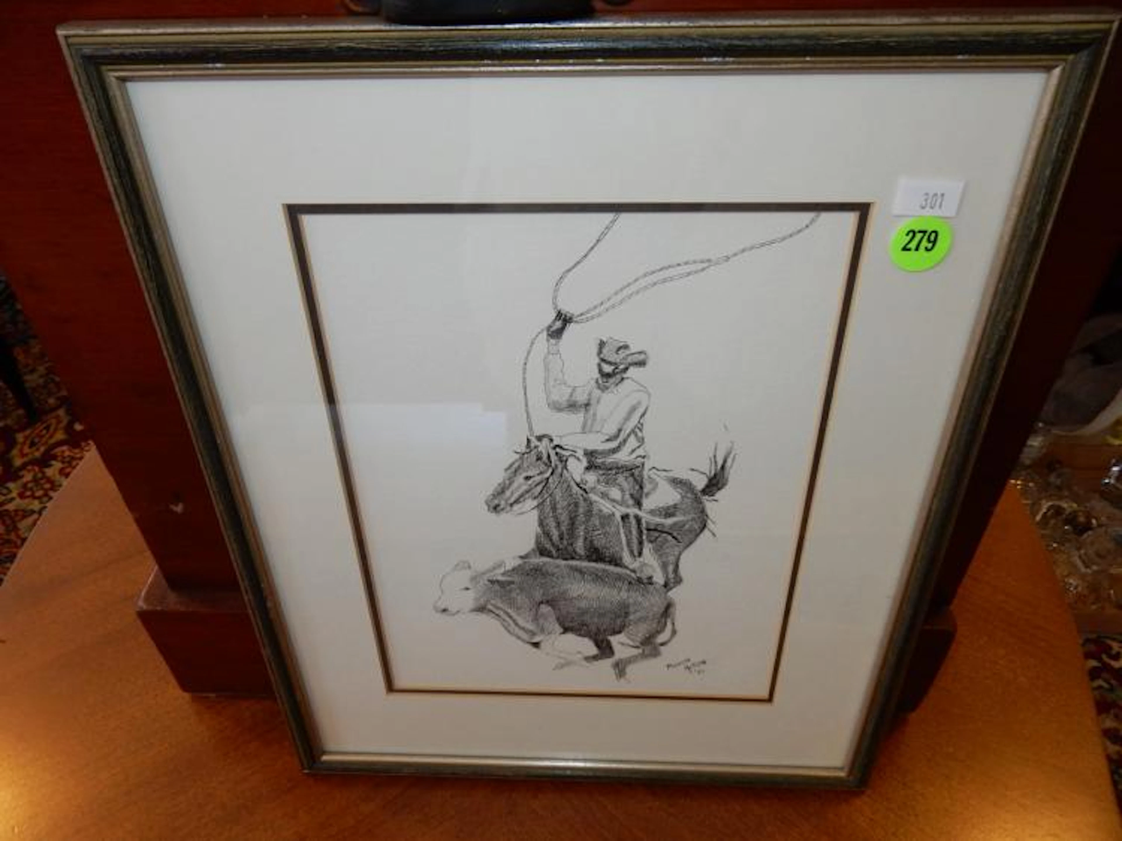 Vintage framed drawing depicting cowboy roping cow, signed Marion Nelson 1982
