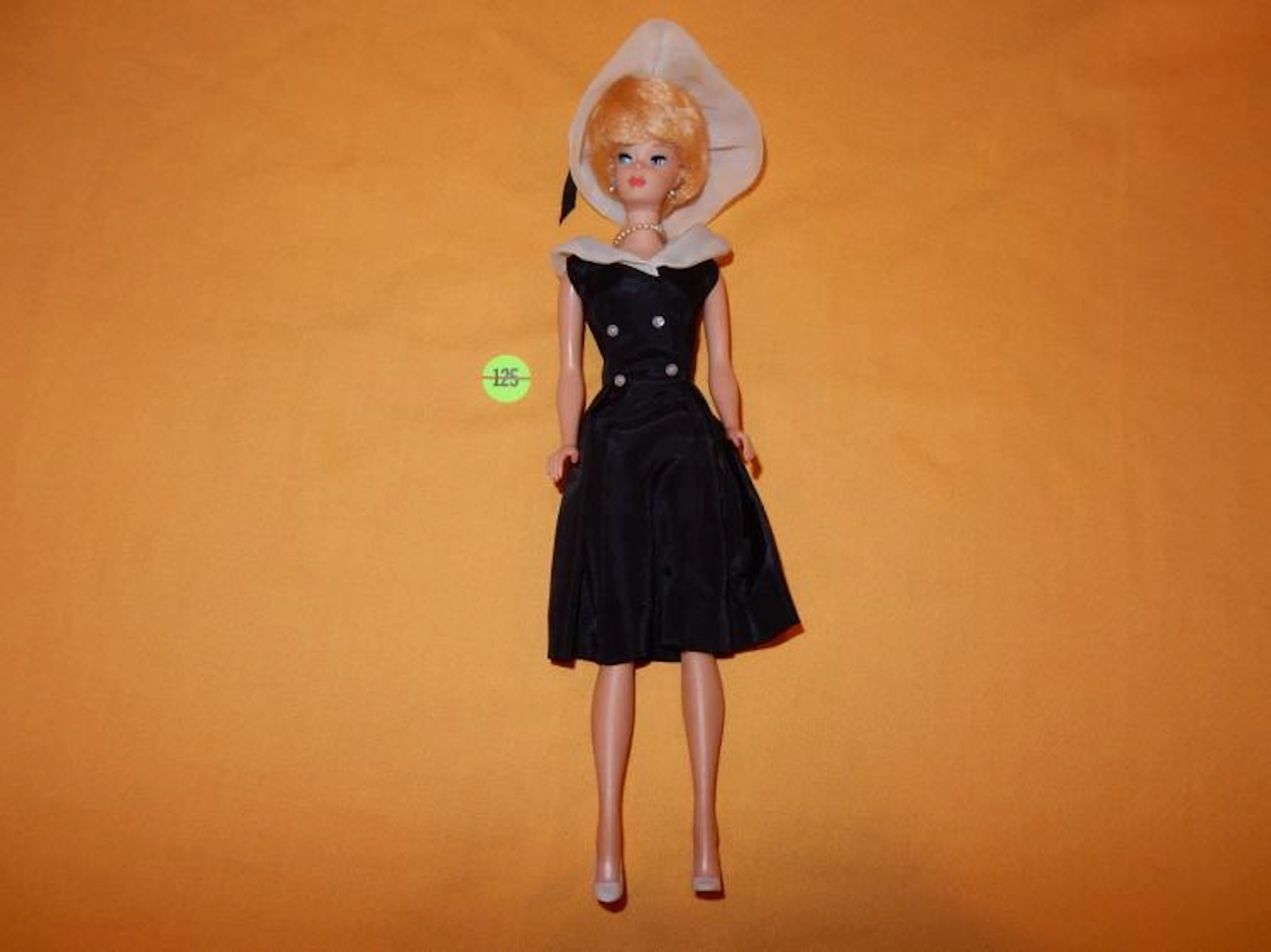 Original 1968 Barbie doll with bubble hair and outfit