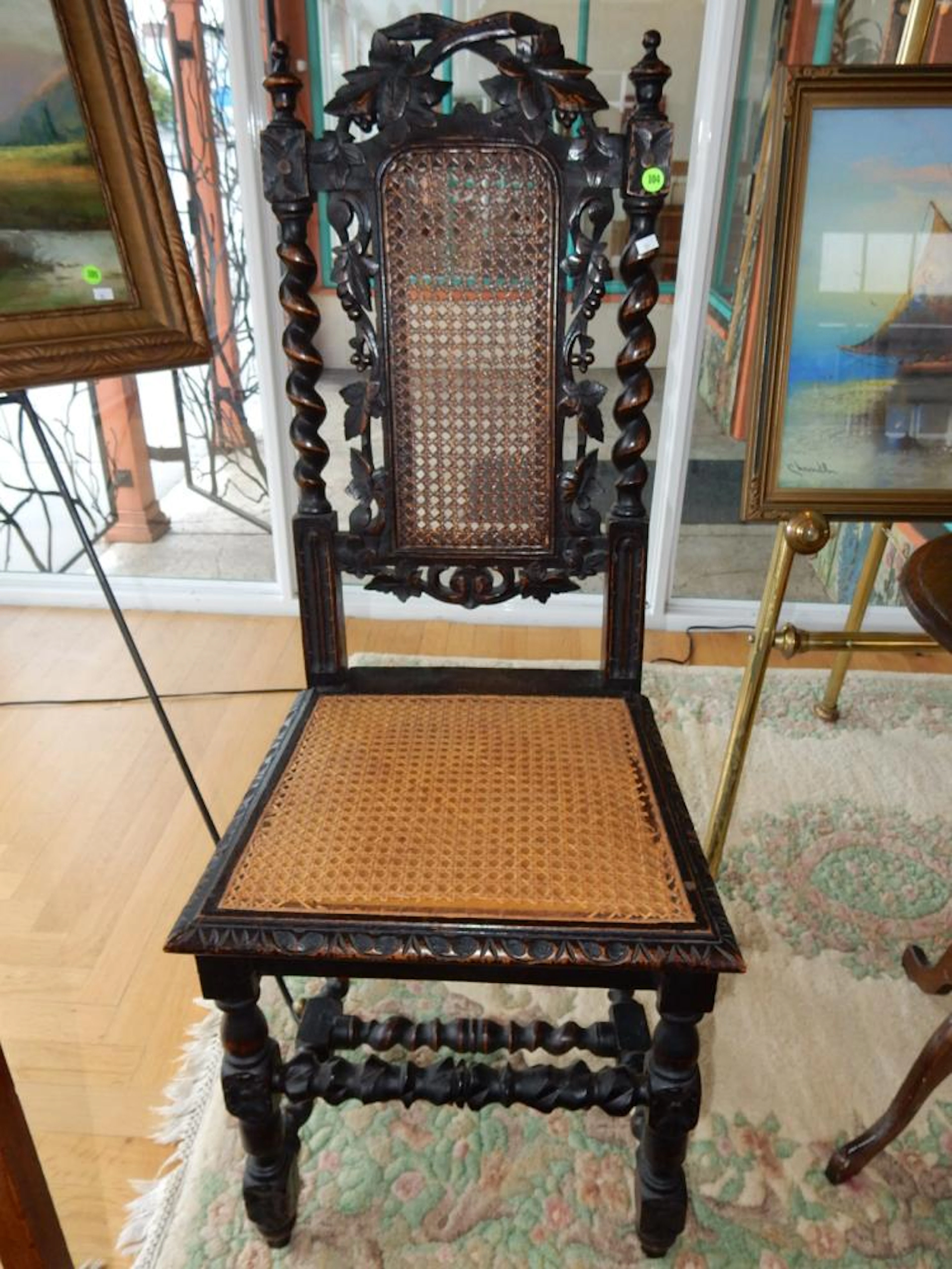 Antique carved dark wood and cane chair, cannot ship in-house