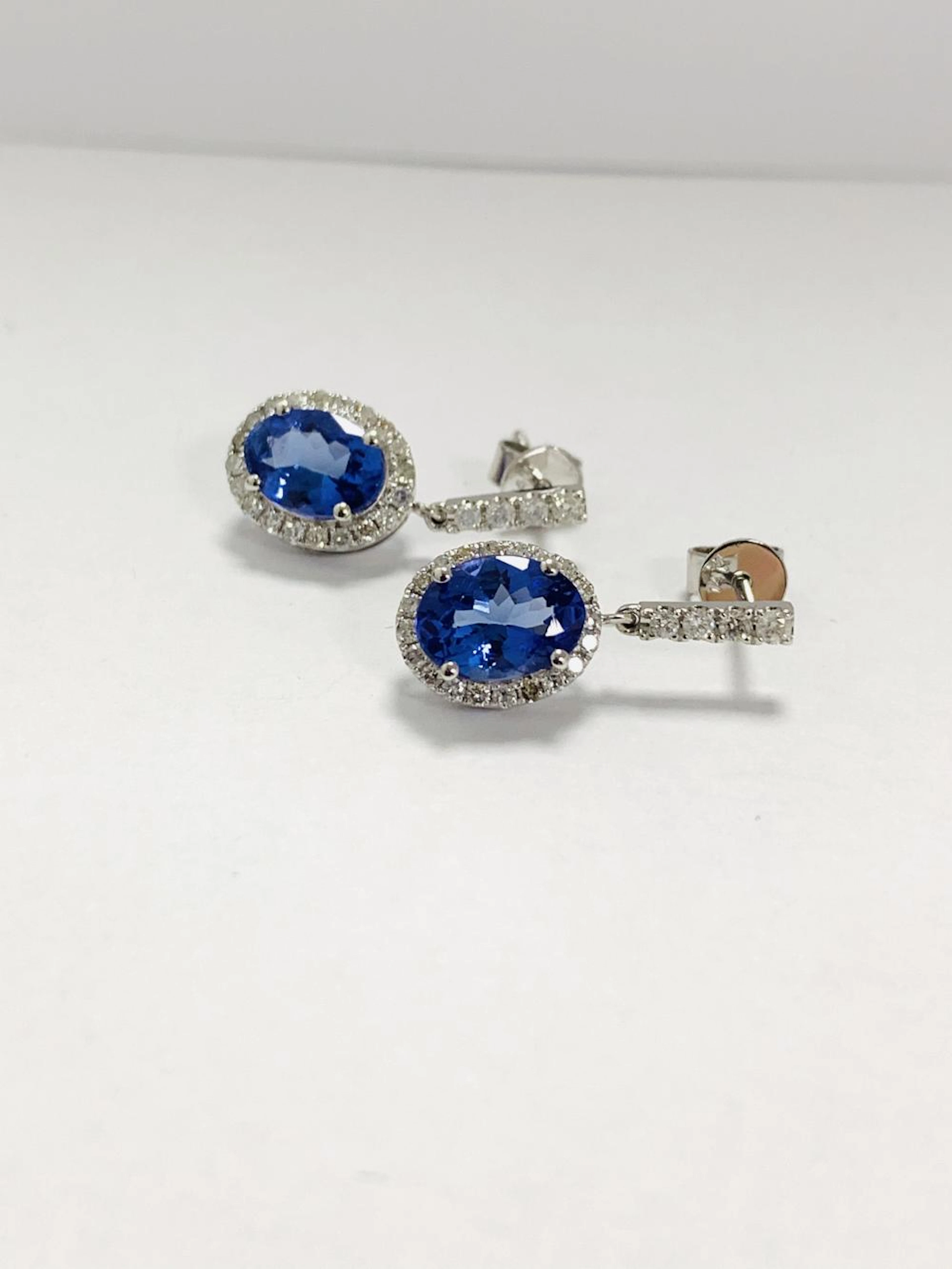14ct White Gold Tanzanite and Diamond halo earrings