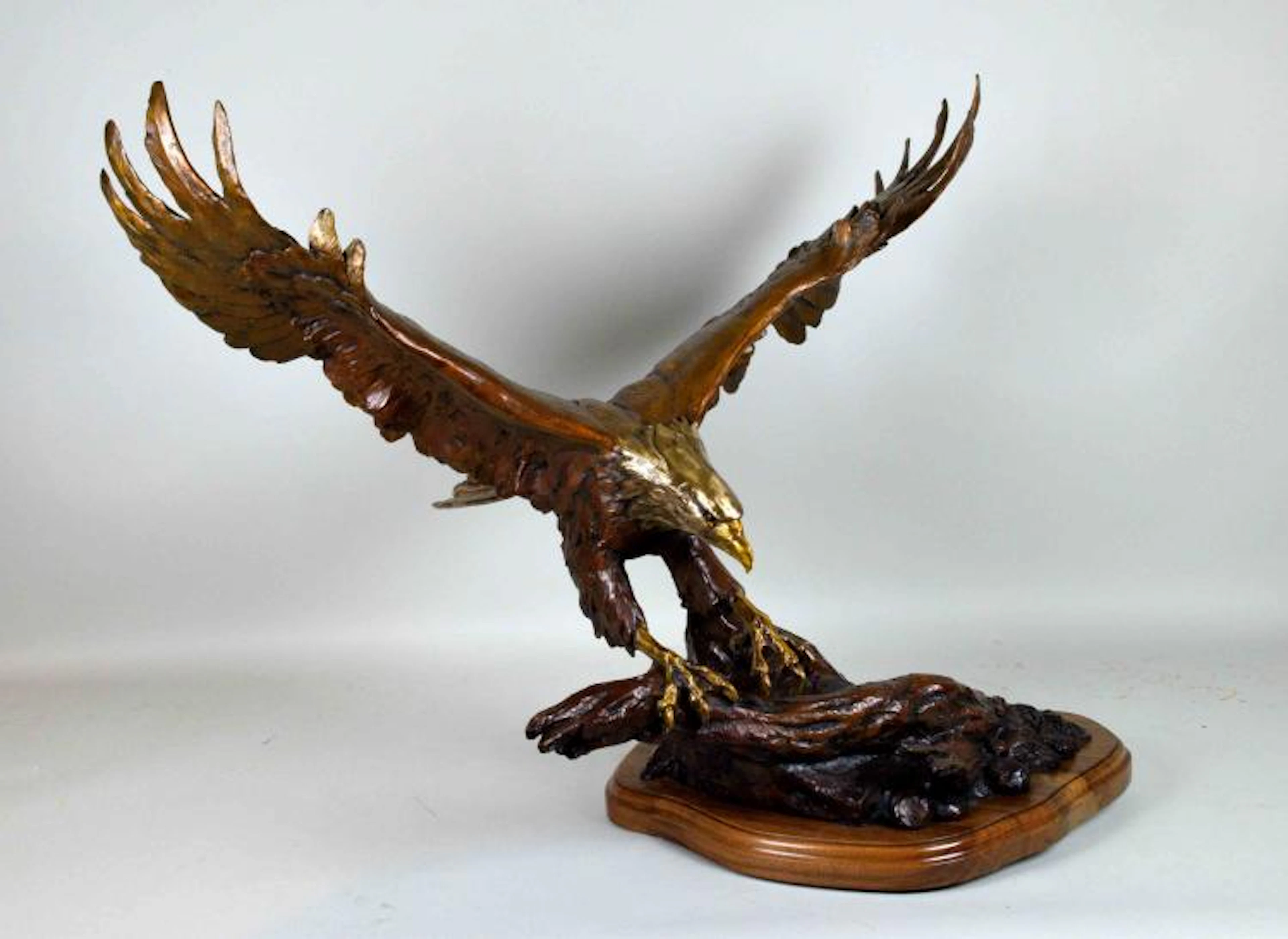 SANDY SCOTT (AMERICAN/CO/IA, b. 1943) BRONZE ''ABOVE IT ALL'' - Eagle; Signed ''Sandy Scott 98 12/35''; Measures: 28''H x 35''W x 19''D; Provenance: Purchased from National Sculptors' Guild, in 2002 f