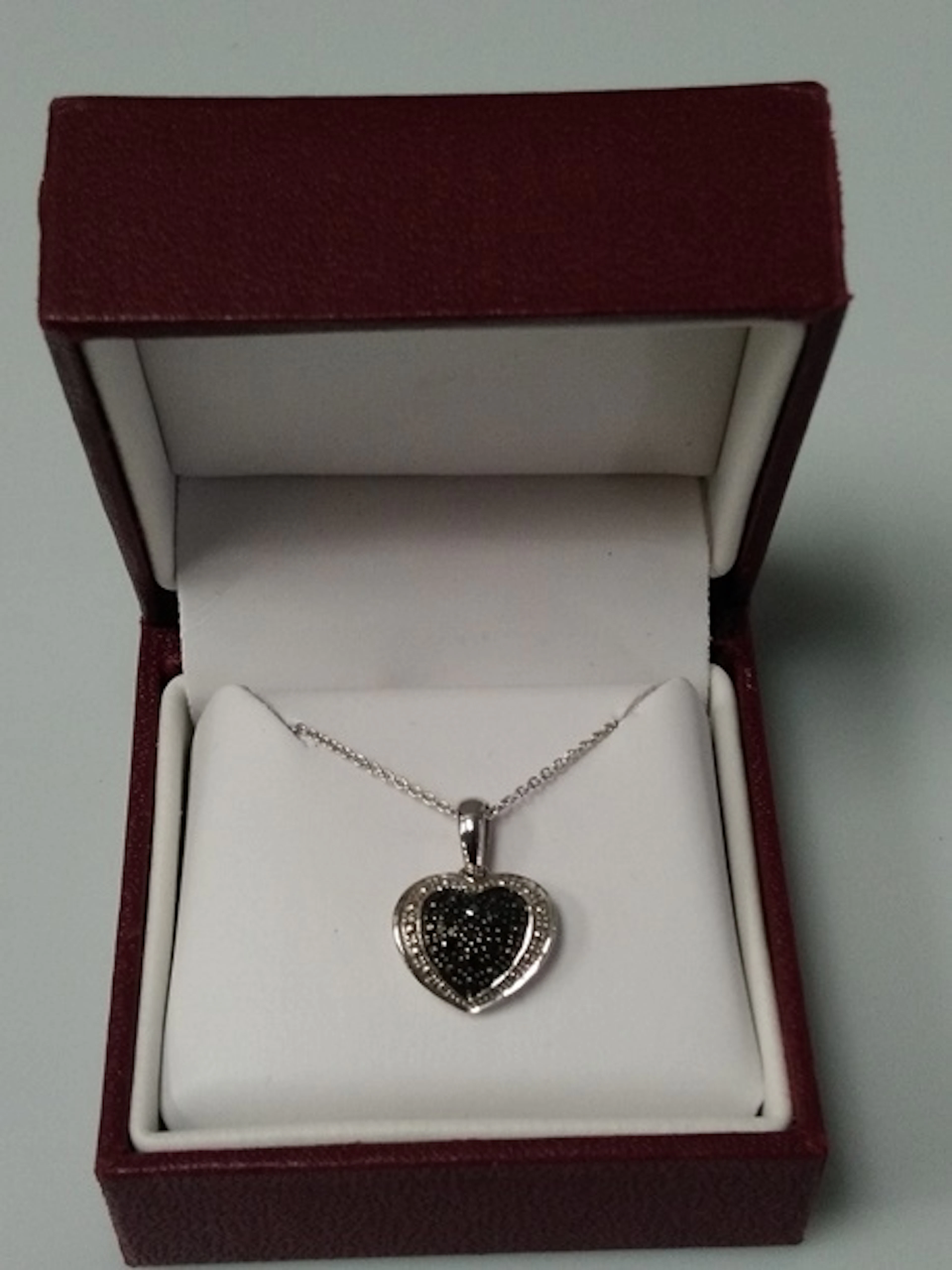 Sterling Silver Heart w/Black Diamonds. Chain.
