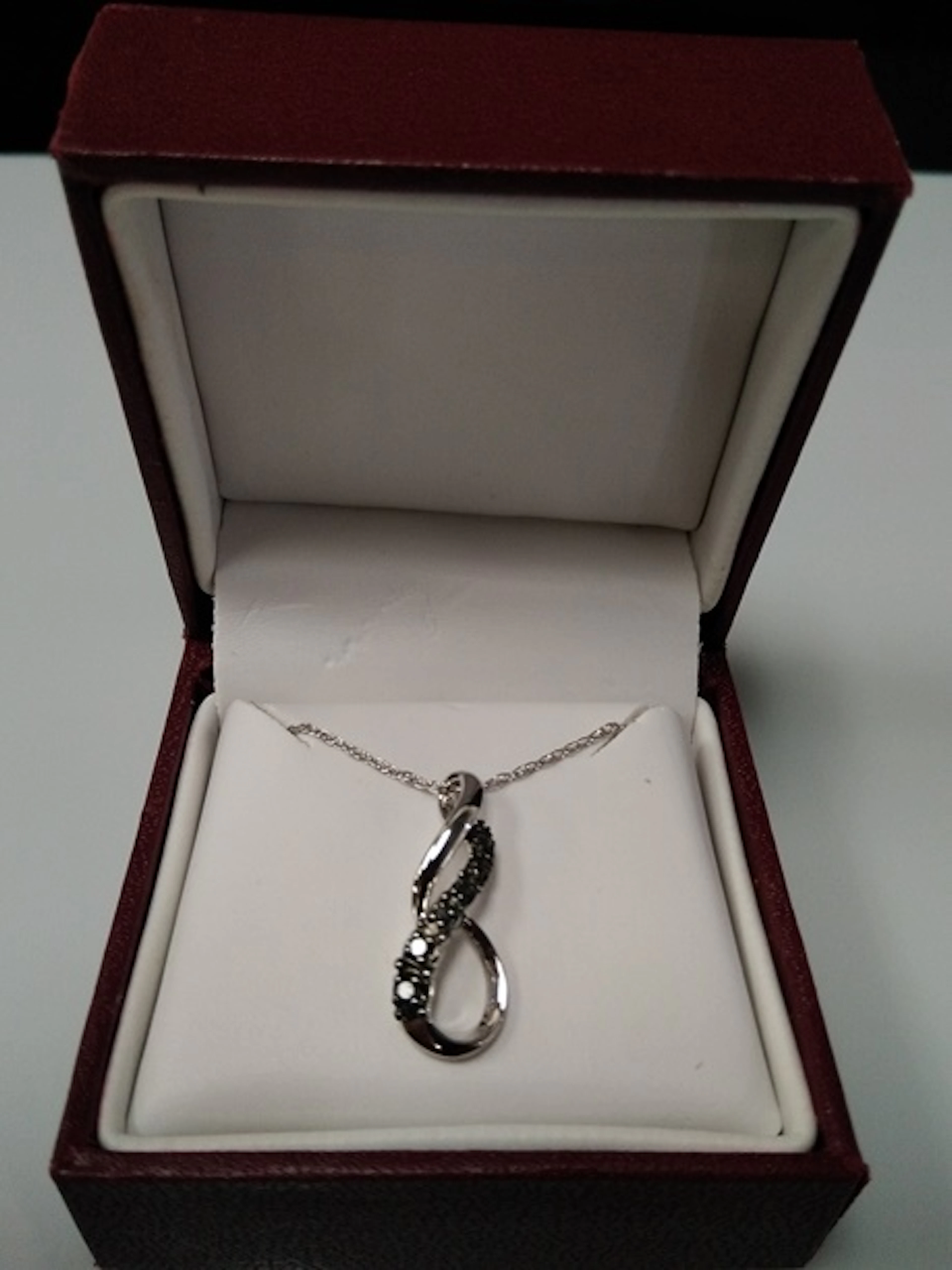 Sterling Love Knot Pendant w/Black Diamonds.