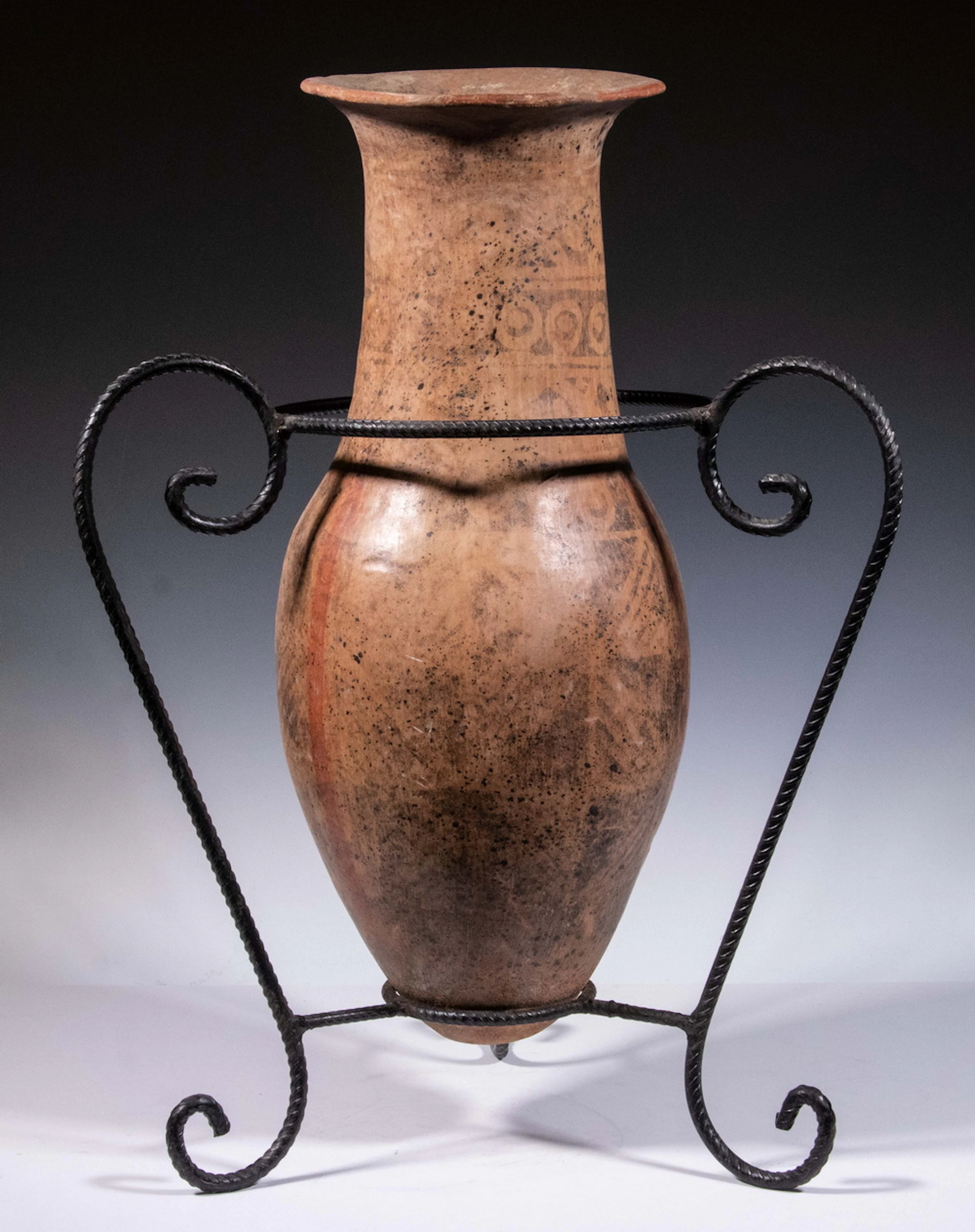 LARGE PRECOLUMBIAN POT IN METAL STAND