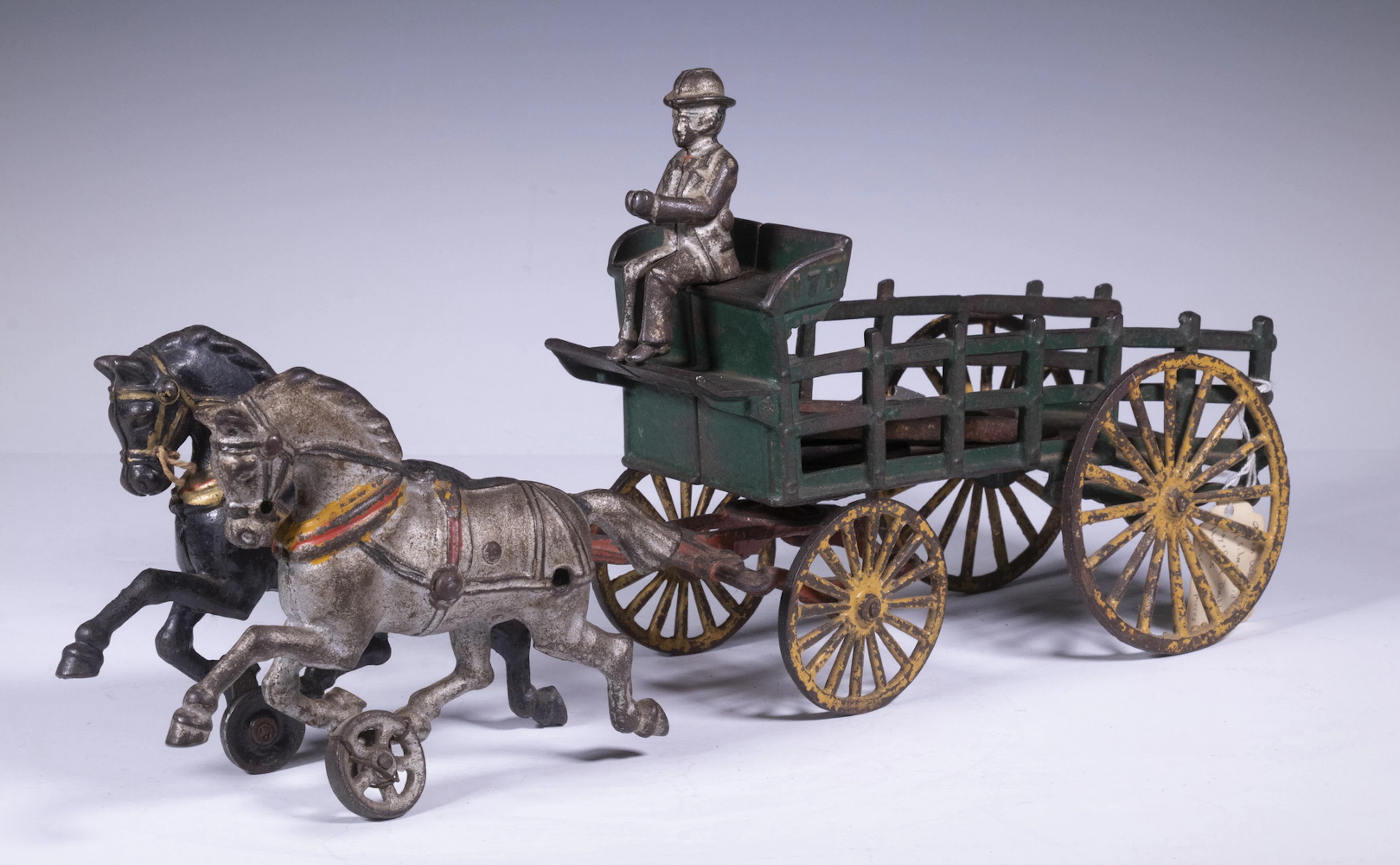 CAST IRON STAKE WAGON TOY