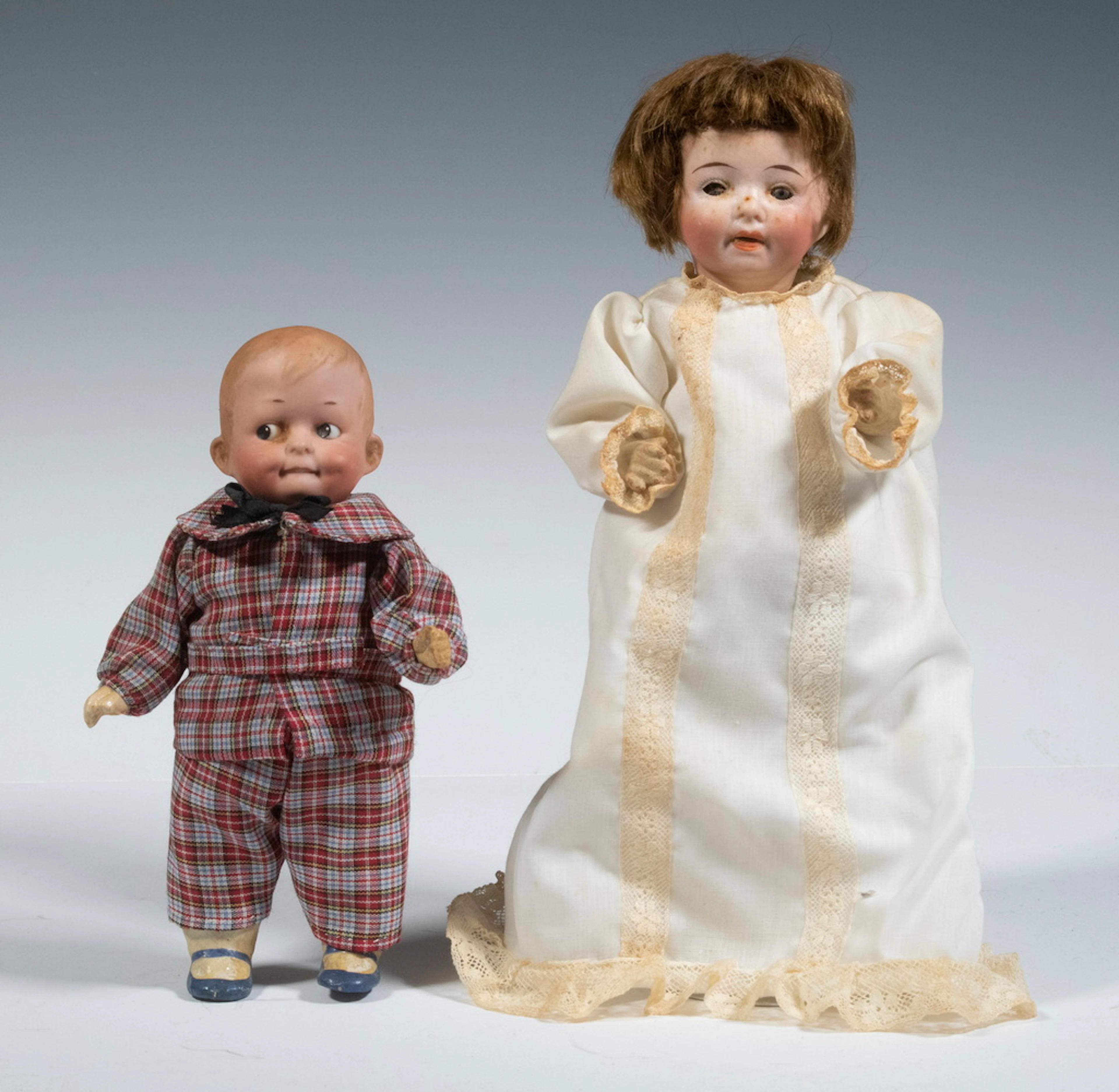 BISQUE HEAD BOY AND GIRL DOLLS