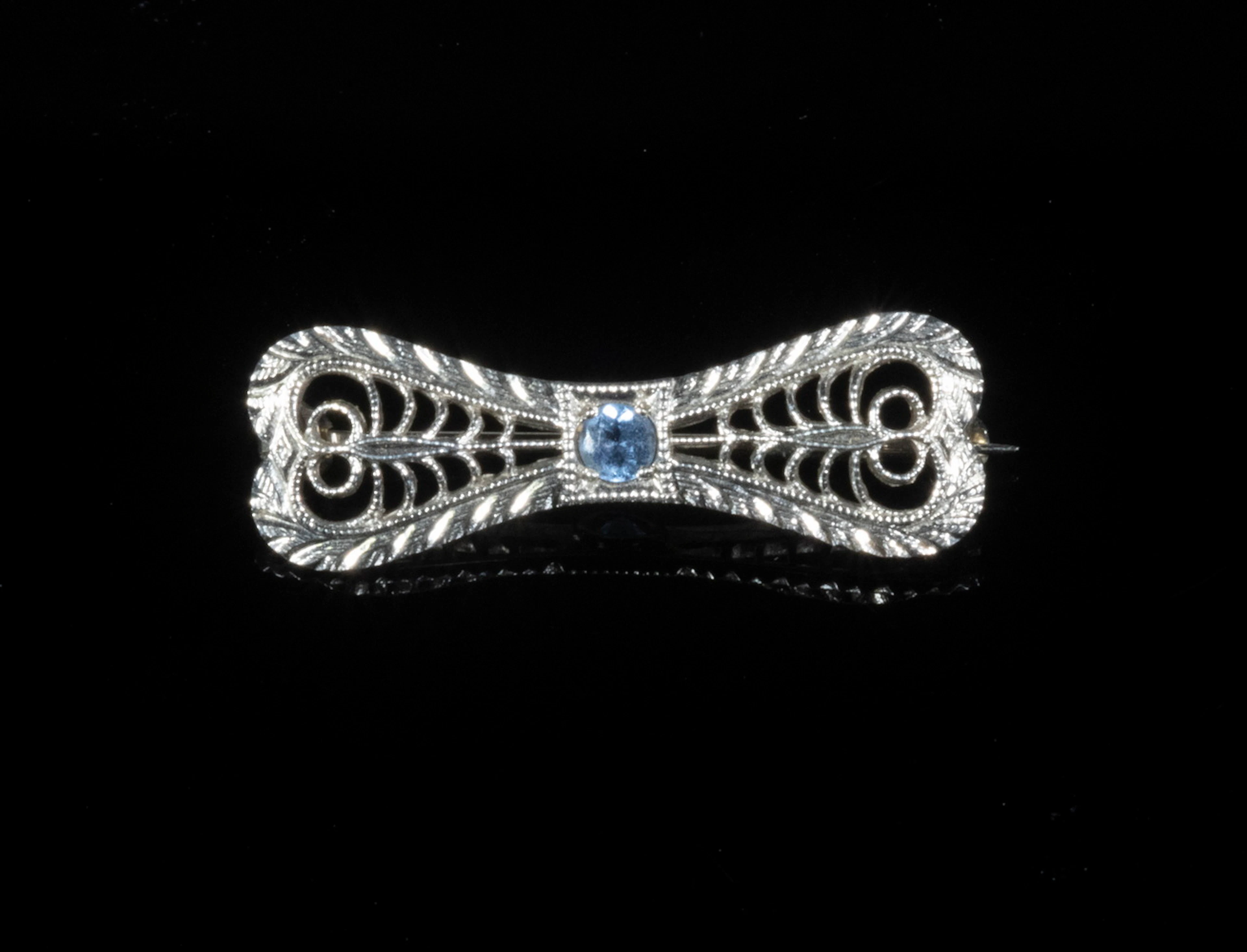 GOLD BOW PIN WITH AQUAMARINE