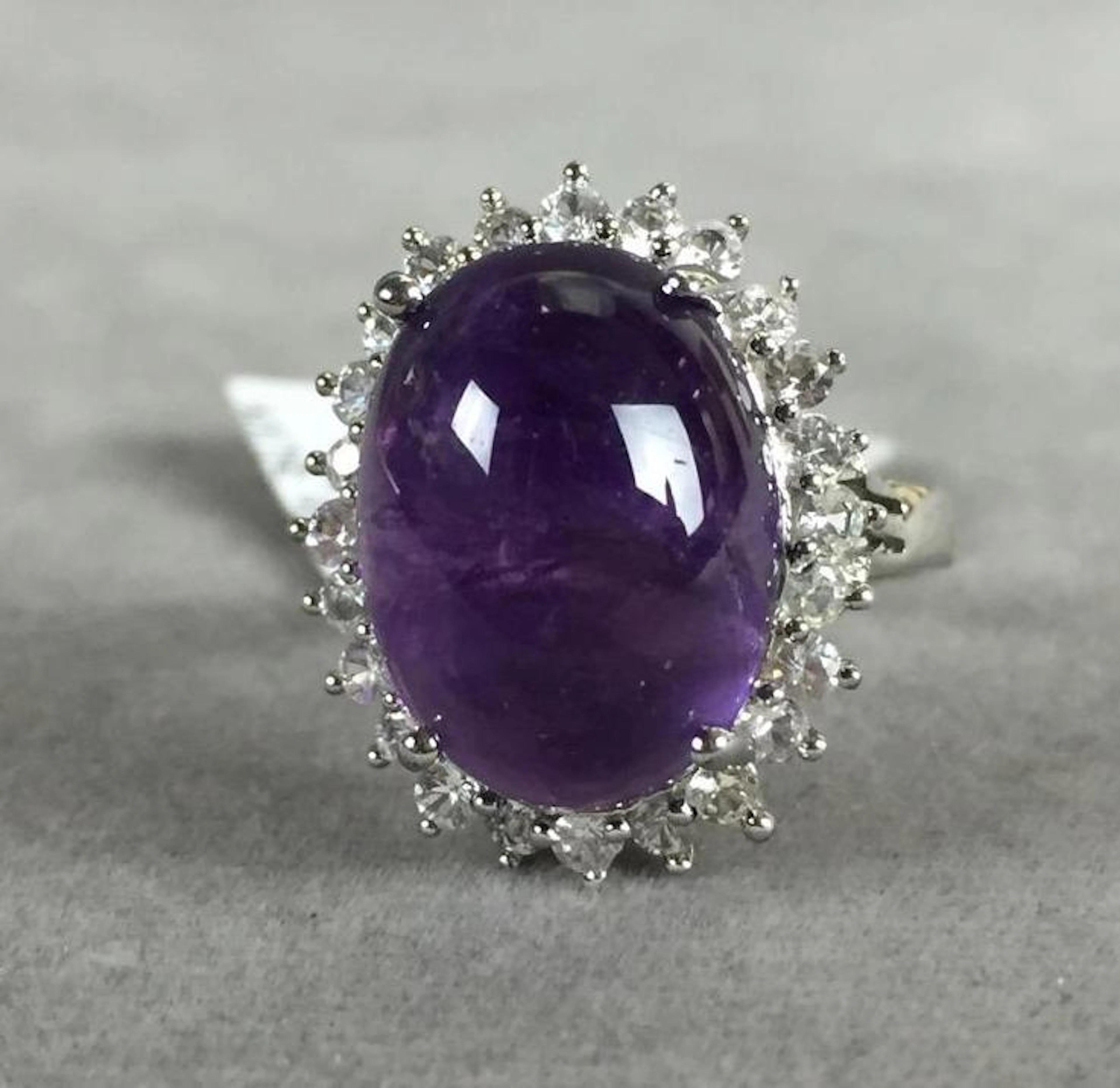 Amethyst set in Sterling silver Ring, (Amethyst 10.70ct, sapphire 0.92ct) marked "925", size 7, GLA appraisal of $6,270.00