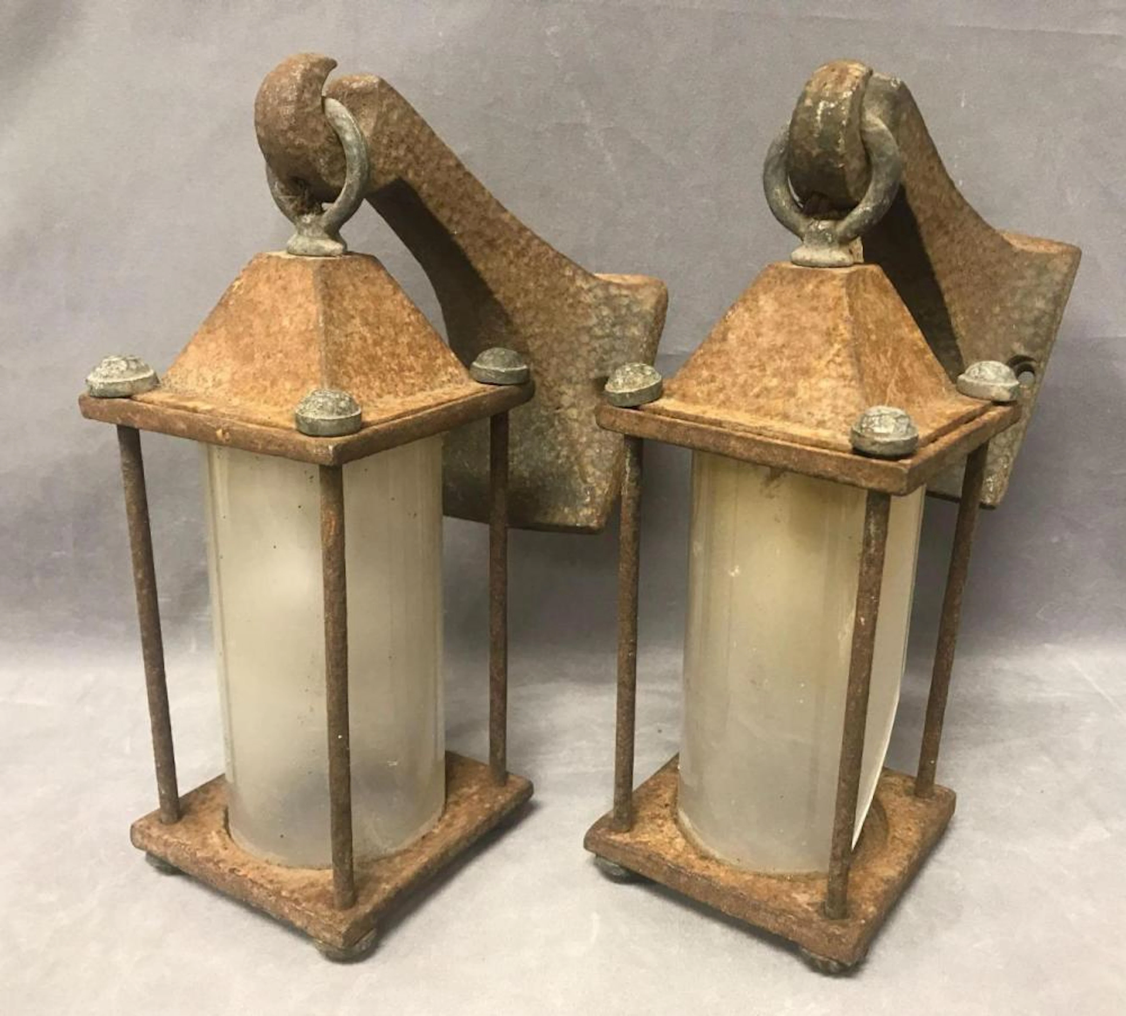 Pair of antique Arts & Crafts wrought iron outdoor lighting fixtures