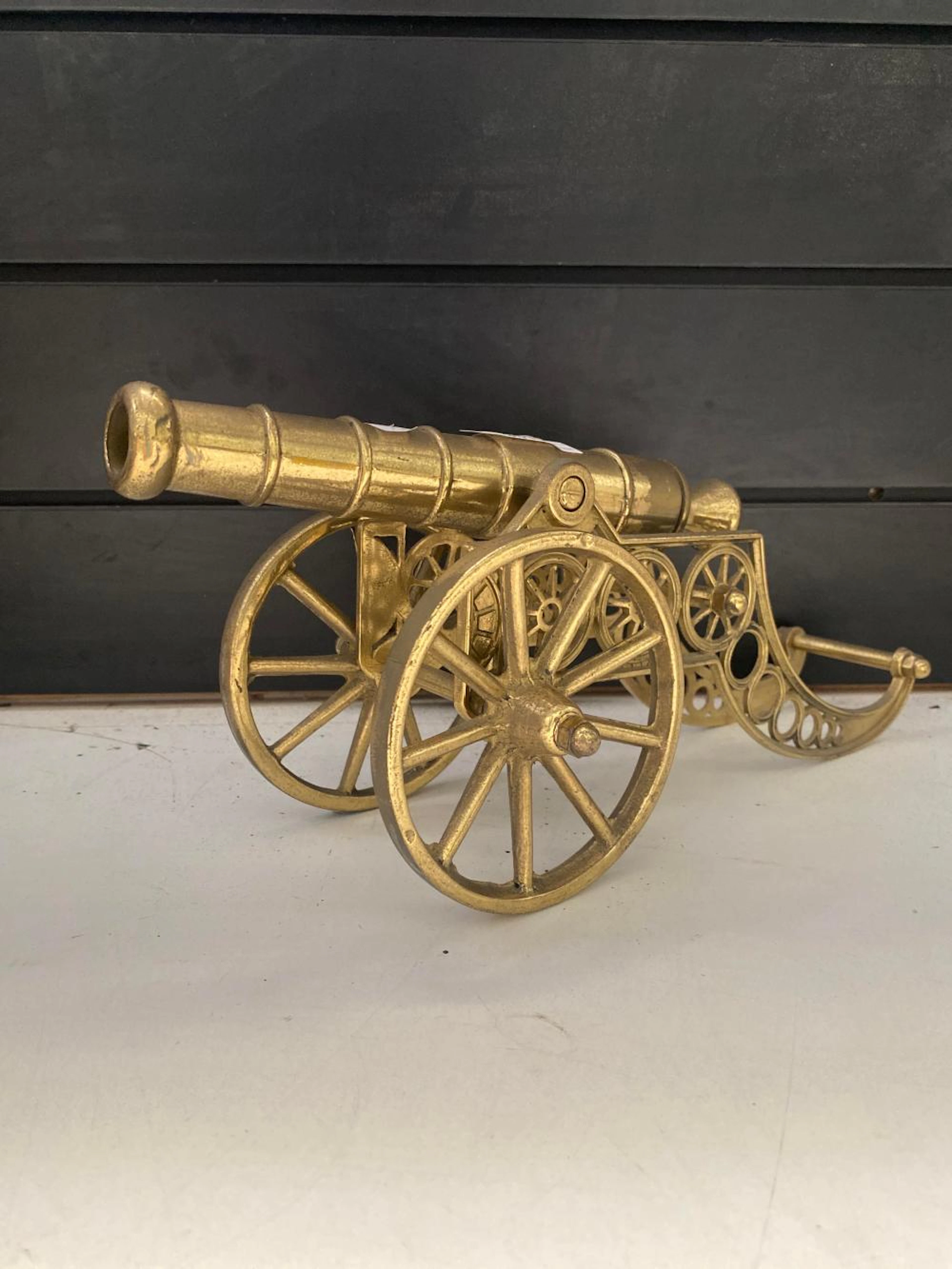 Ornate cast brass model cannon