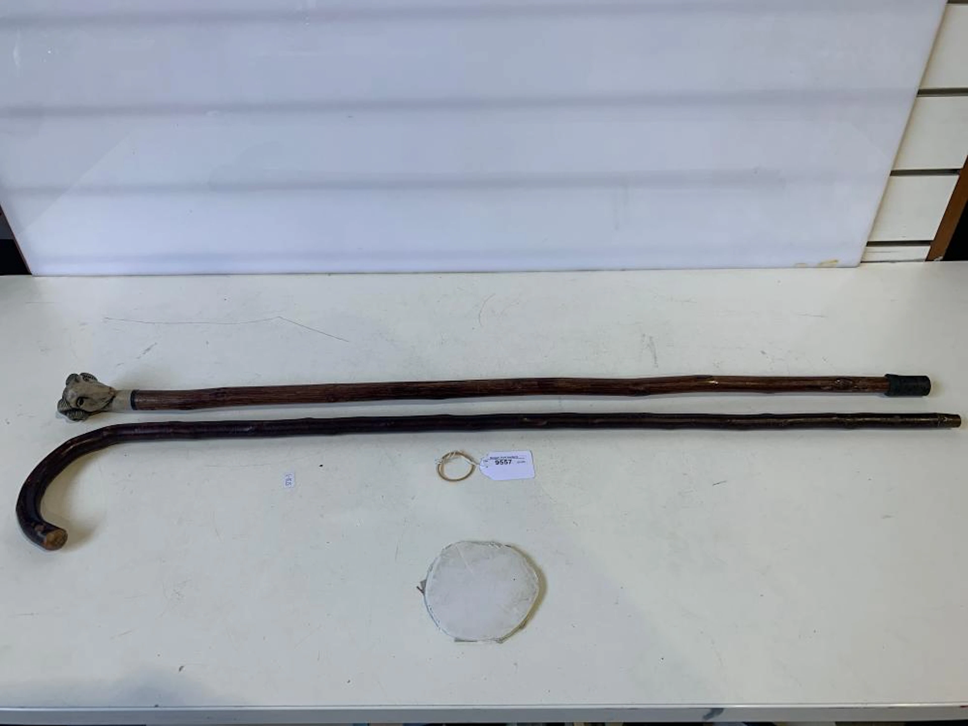 2 x walking sticks, one with rams head handle. 92cm L.