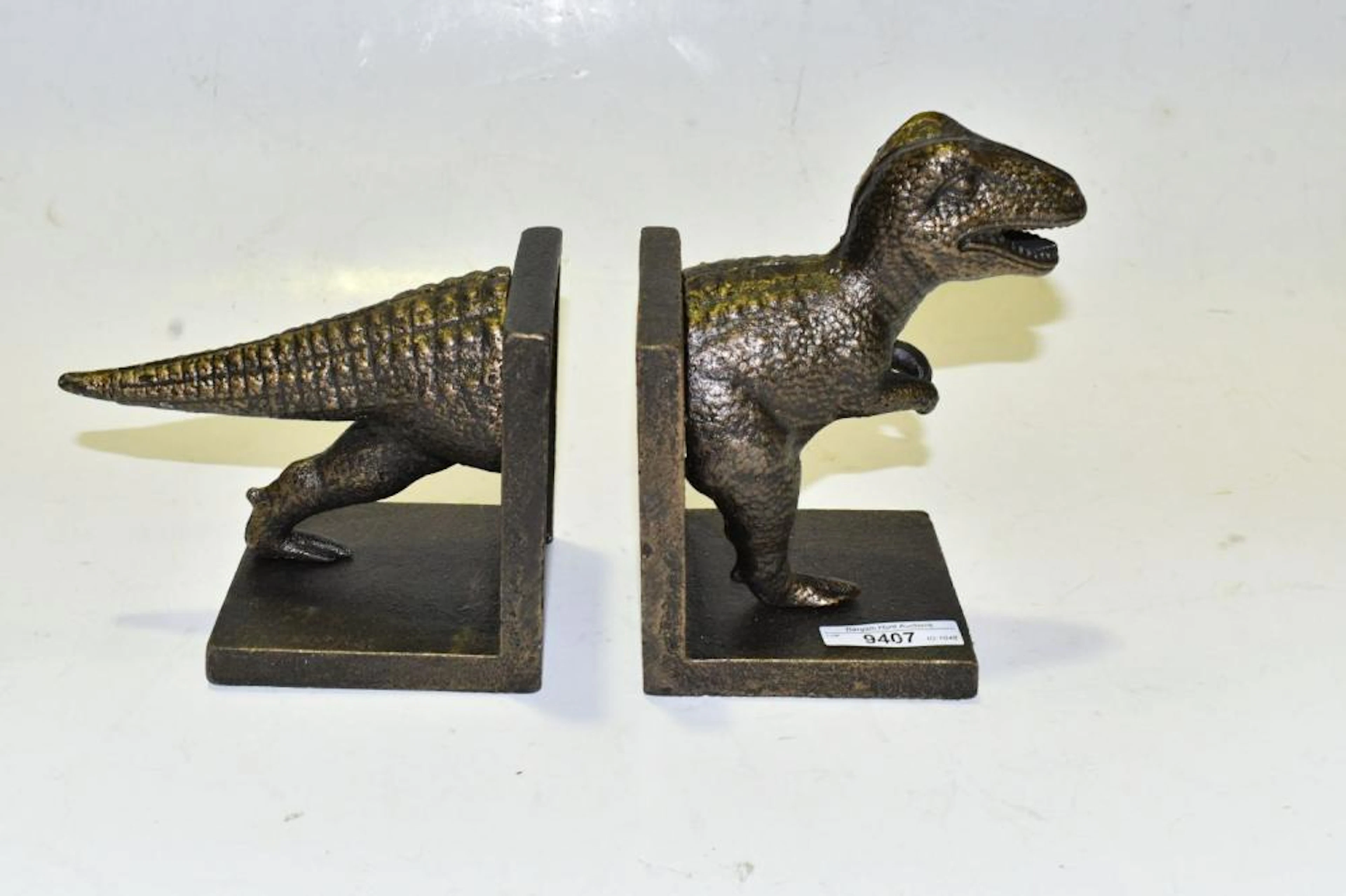Cast iron T-Rex book ends.