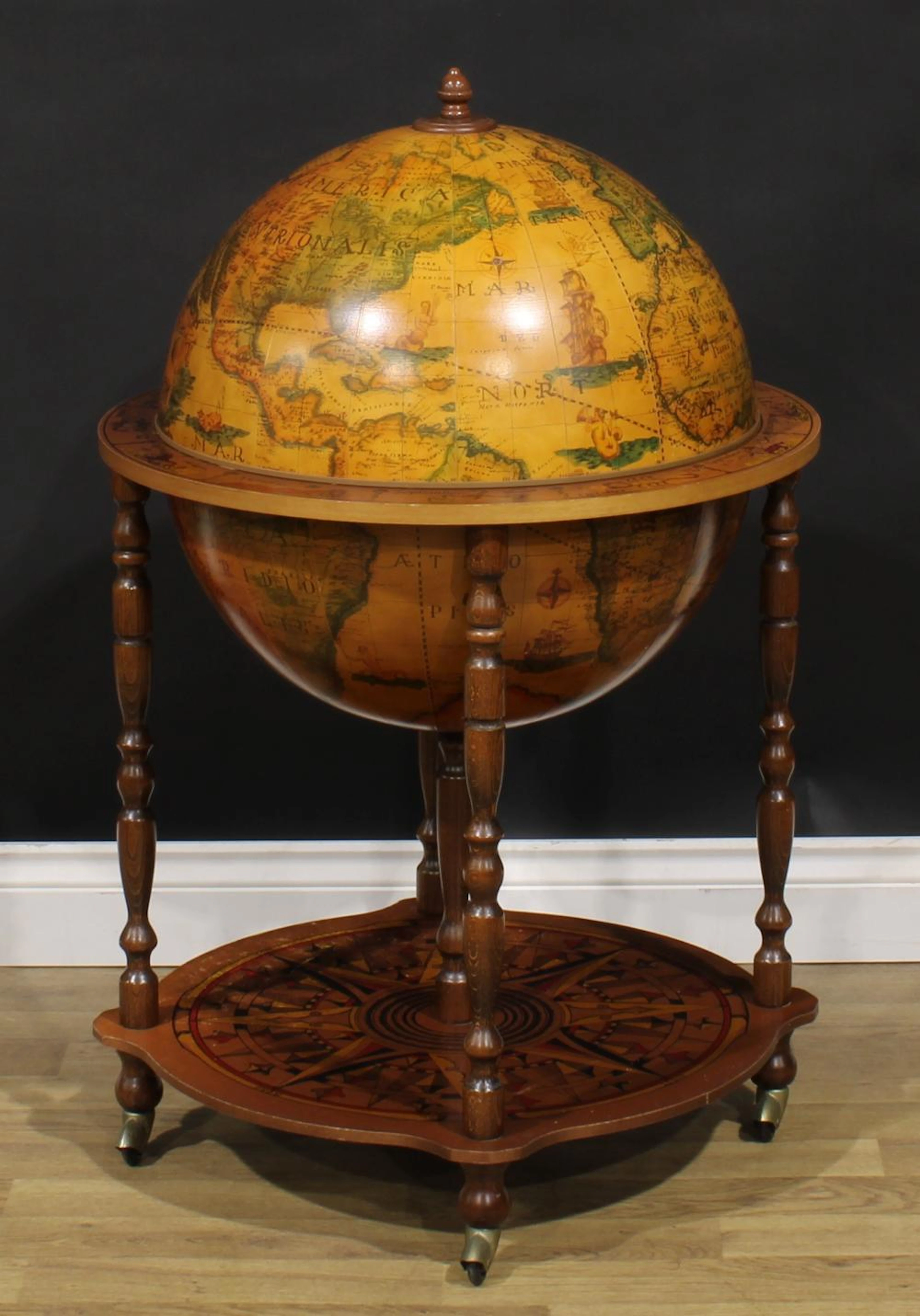A Da Vinci type bar globe. 92cm high, 59.5cm diameter