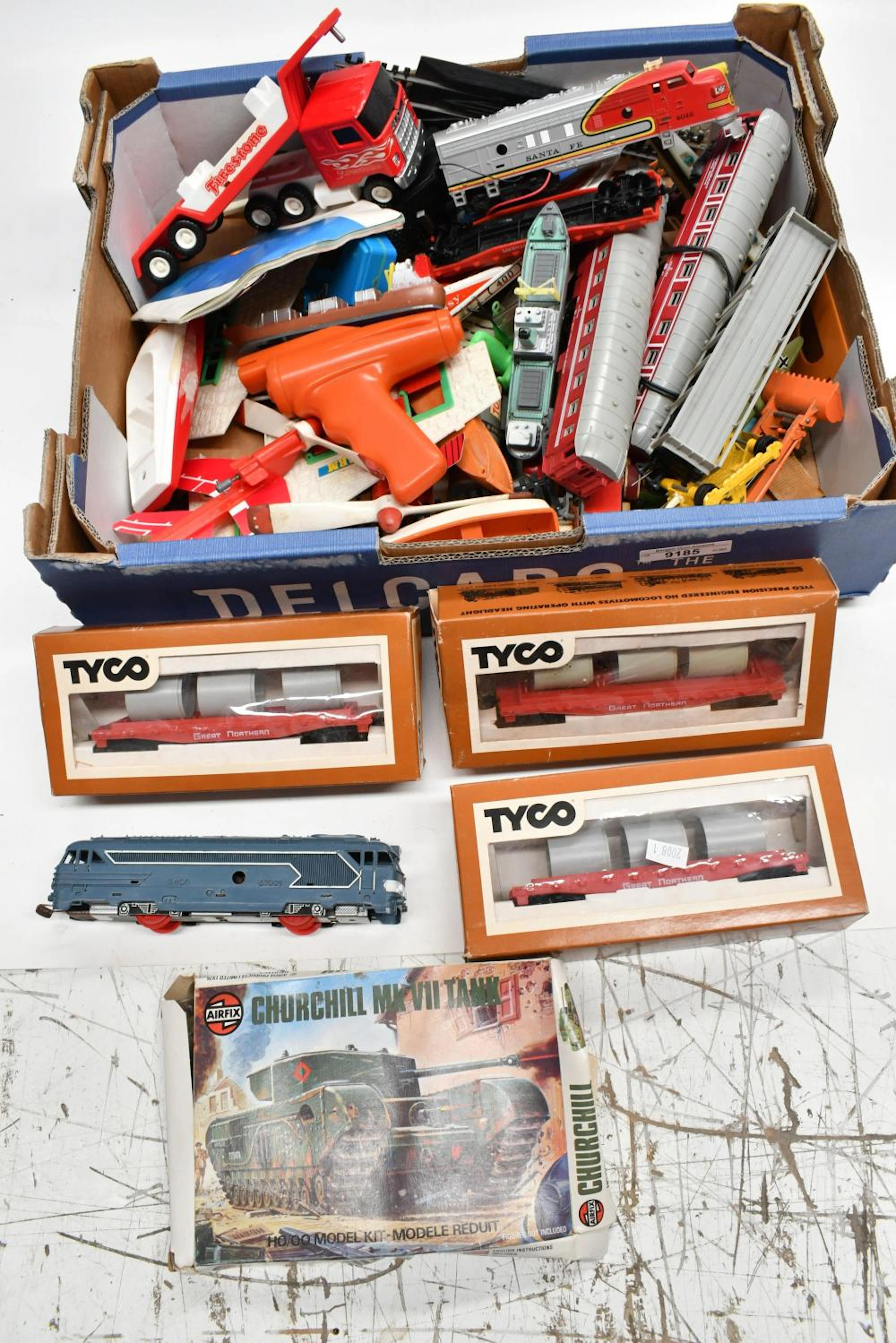 Collection of vintage toys including boxed Tyco HO scale rolling stock