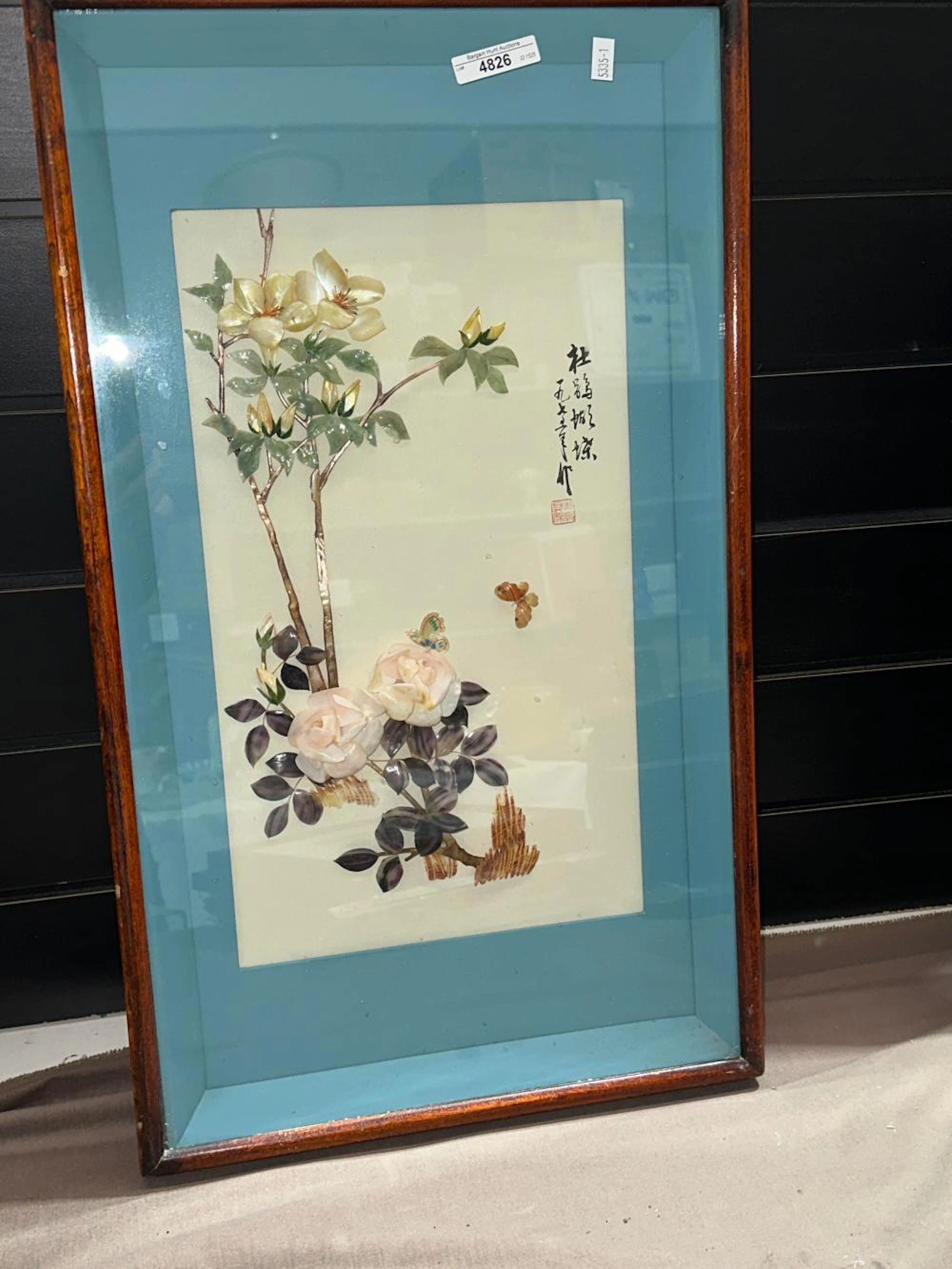Framed artwork with shell floral design in relief