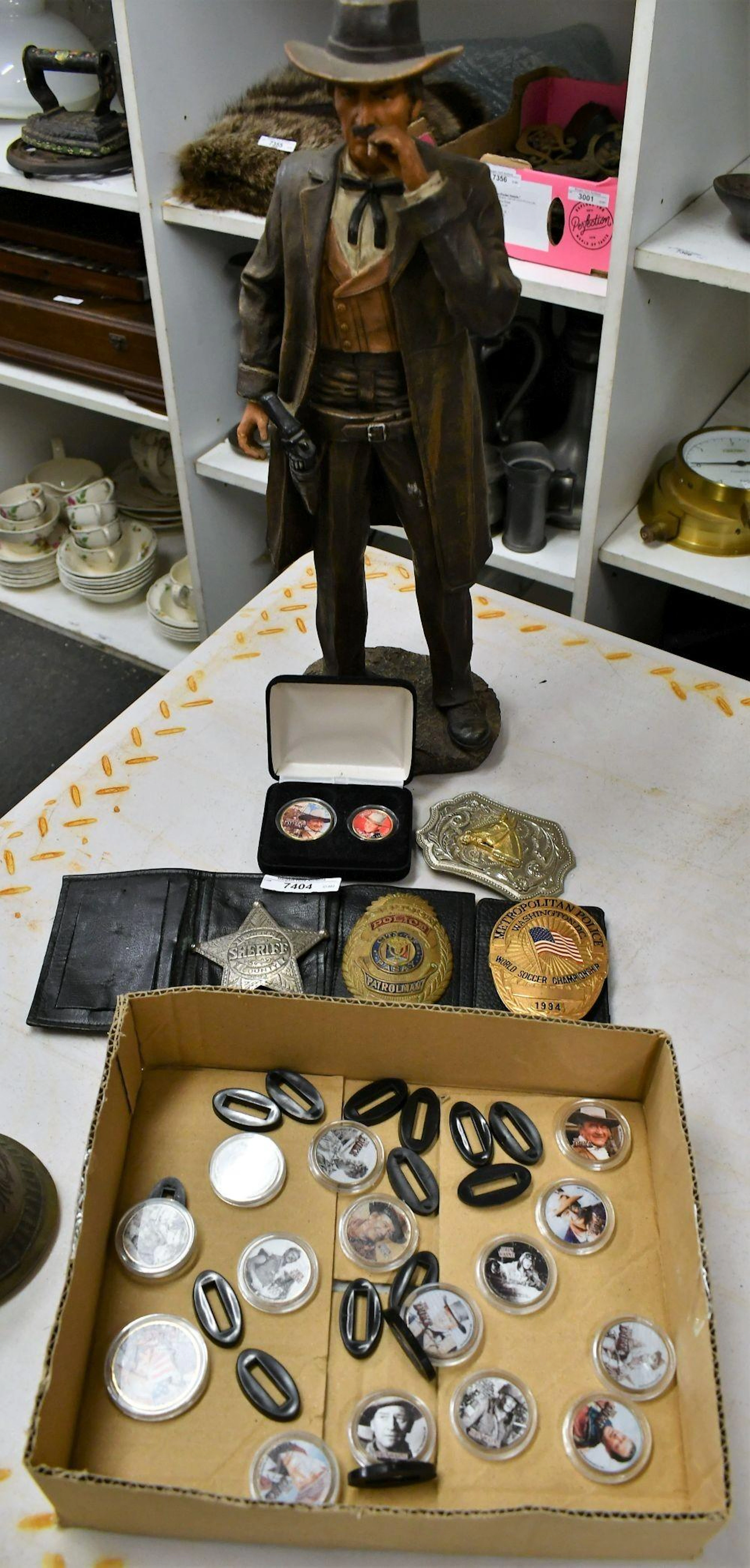 Collection of novelty items including horse head belt buckle