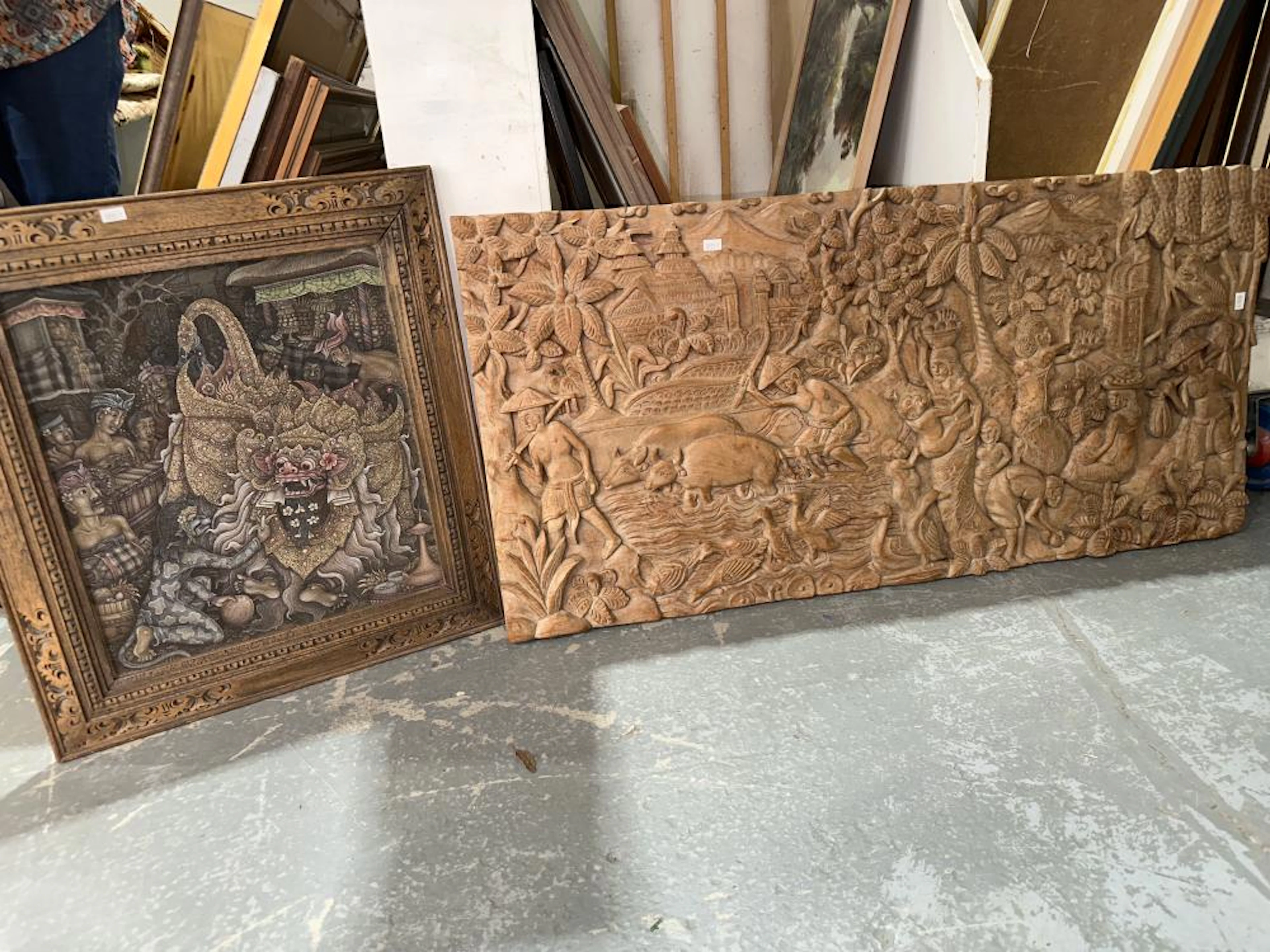 Carved timber panel of women and monkeys gathering fruit